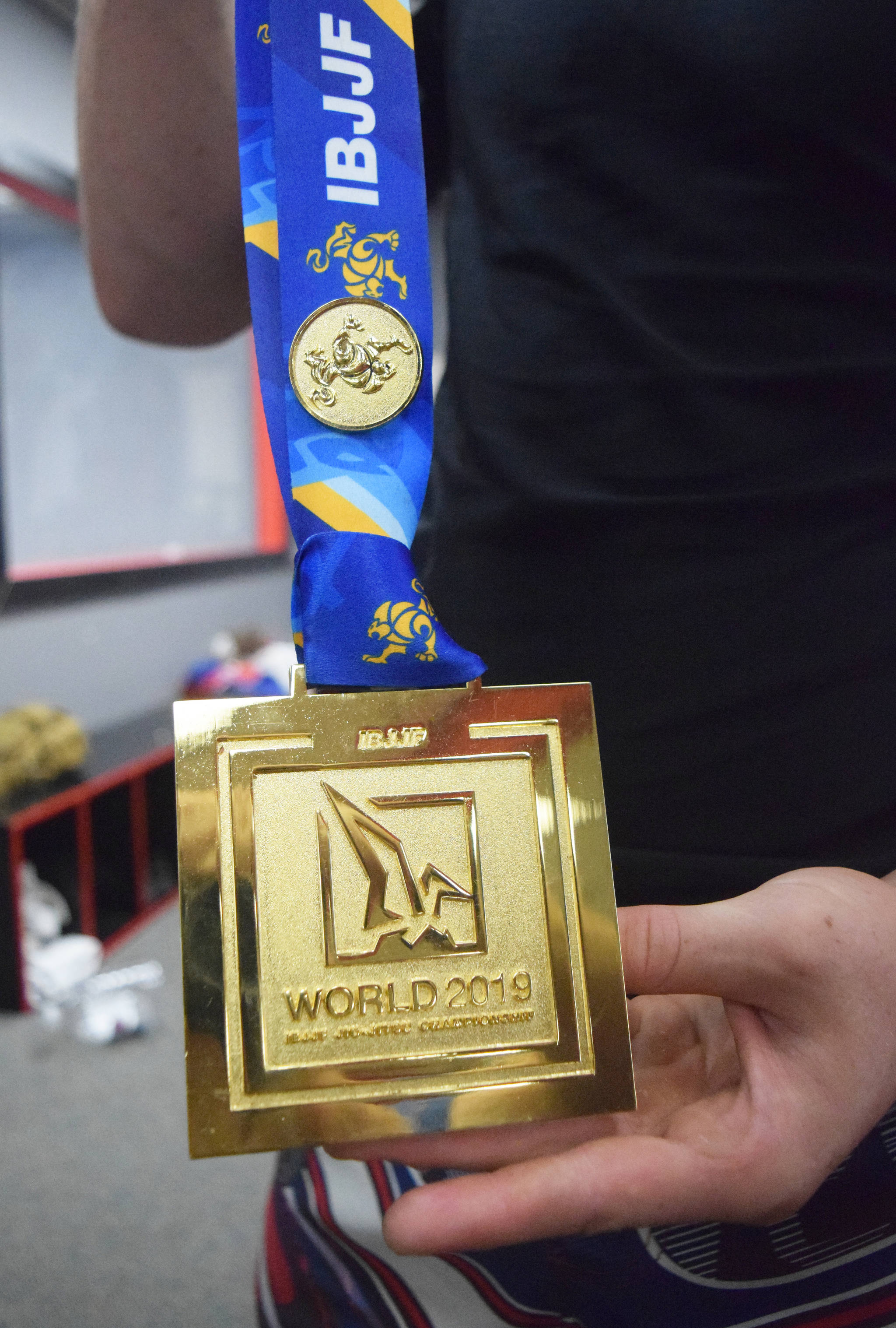Soldotna’s Sean Babitt shows off the first-place medal he won at the IBJJF World Championships June 1 in Long Beach, California. (Photo by Joey Klecka/Peninsula Clarion)