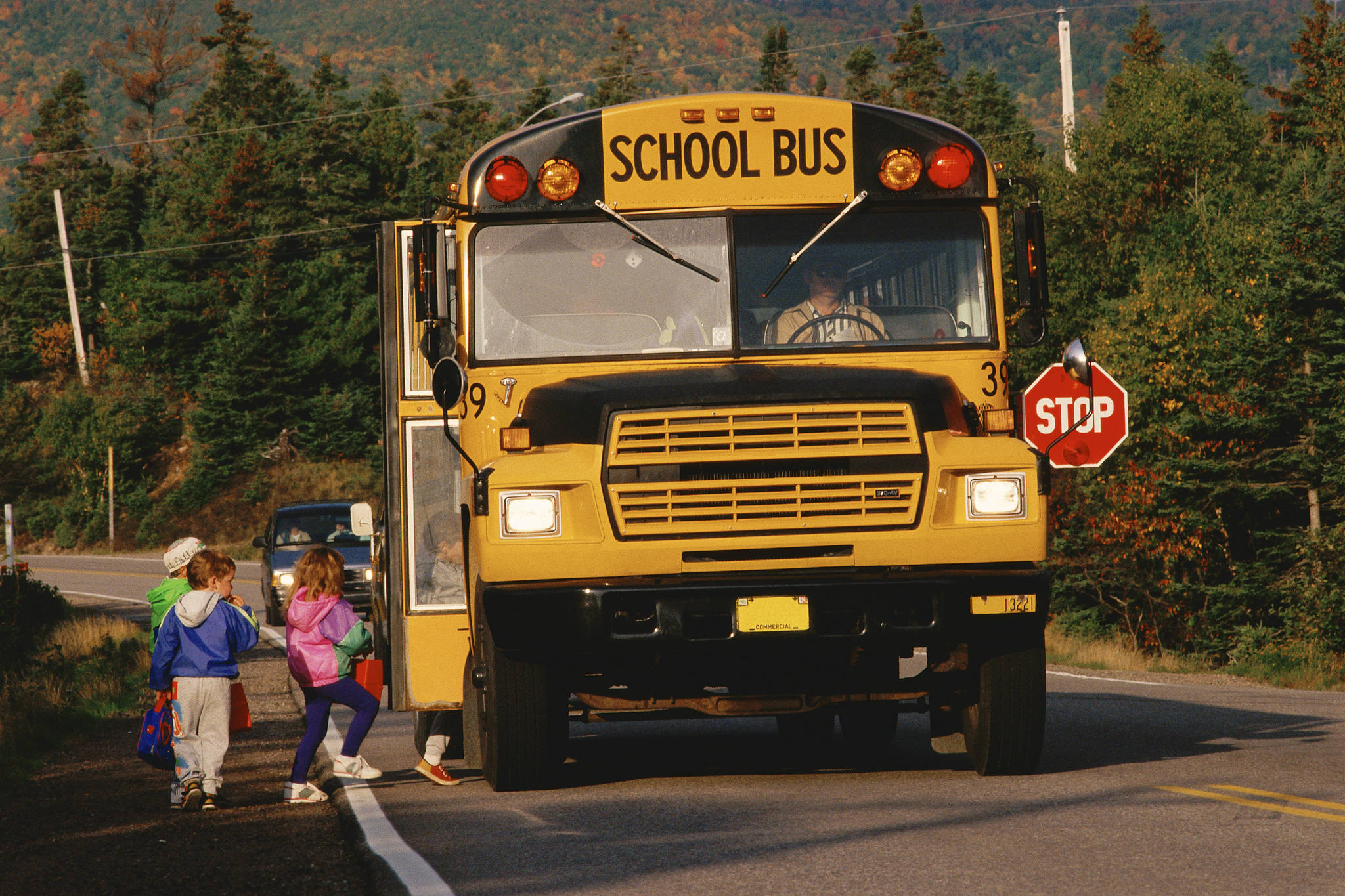 Cars must stop when a school bus flashes its red lights, and remain stopped until the lights are turned off. (Courtesy photo)