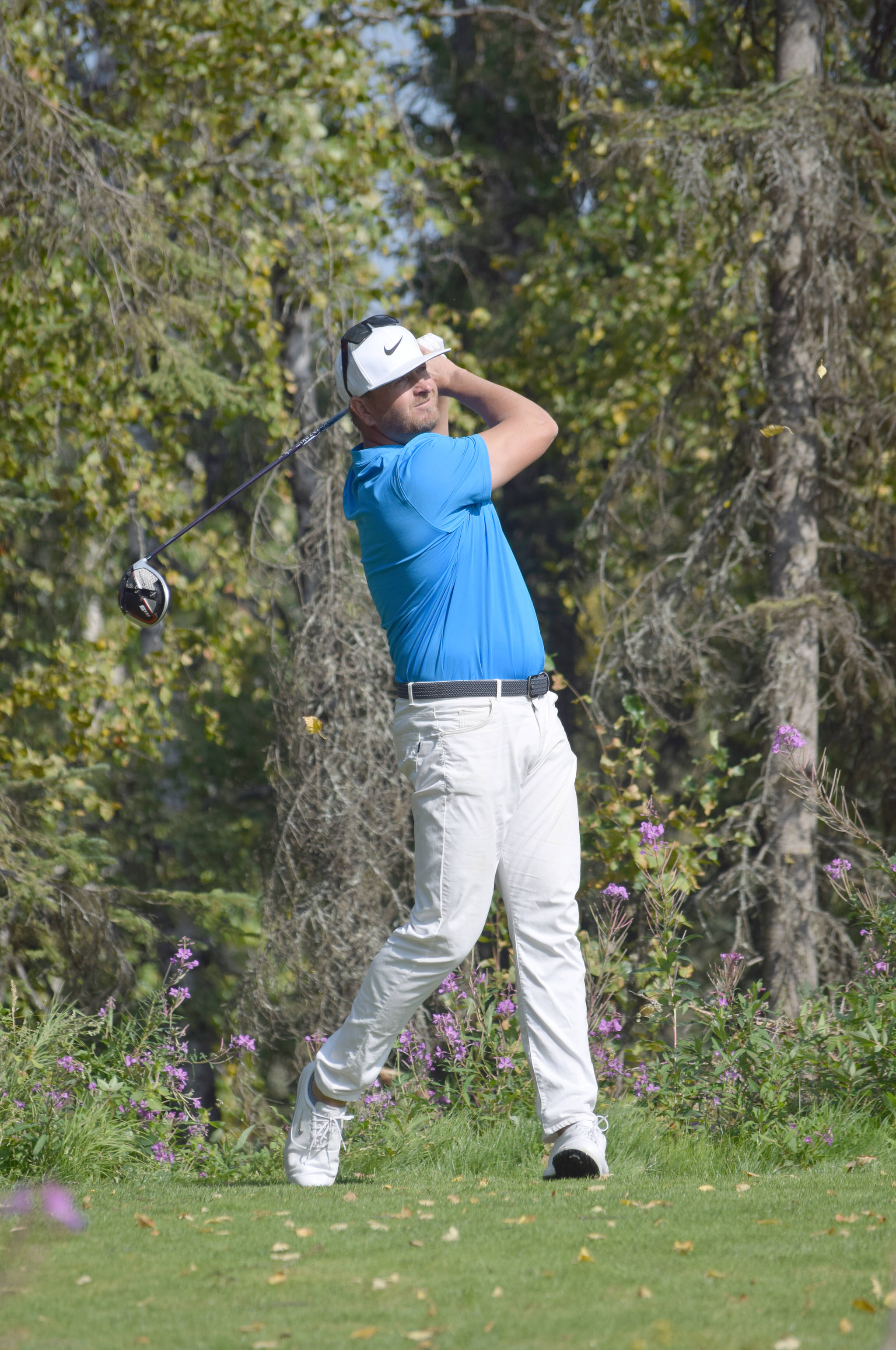 Aaron Dexheimer, a California pro who grew up playing Birch Ridge Golf Course, tees off on No. 12 on Sunday, Aug. 25, 2019, at the Kenai Peninsula Open at Birch Ridge in Soldotna, Alaska. (Photo by Jeff Helminiak/Peninsula Clarion)