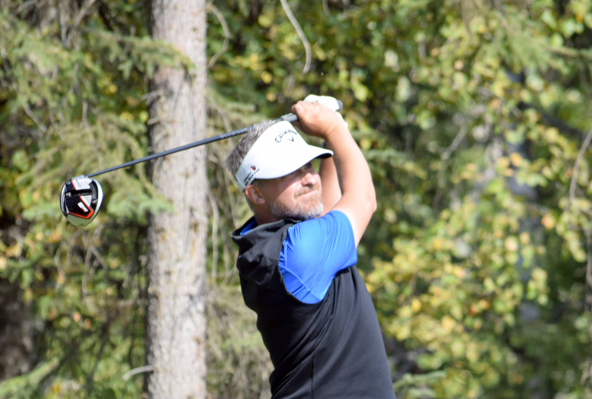 Nolan Rose, an employee at Birch Ridge Golf Course, tees off on No. 11 on Sunday, Aug. 25, 2019, during the Kenai Peninsula Open at Birch Ridge in Soldotna, Alaska. (Photo by Jeff Helminiak/Peninsula Clarion)