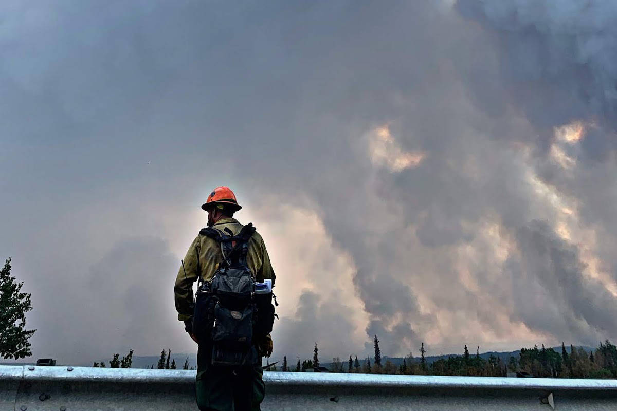 Trinity Hotshots battling the Swan Lake Fire hold the line during burnout operations along the Sterling Highway in Alaska on Aug. 26, 2019. (Photo courtesy Great Basin Incident Management Team)