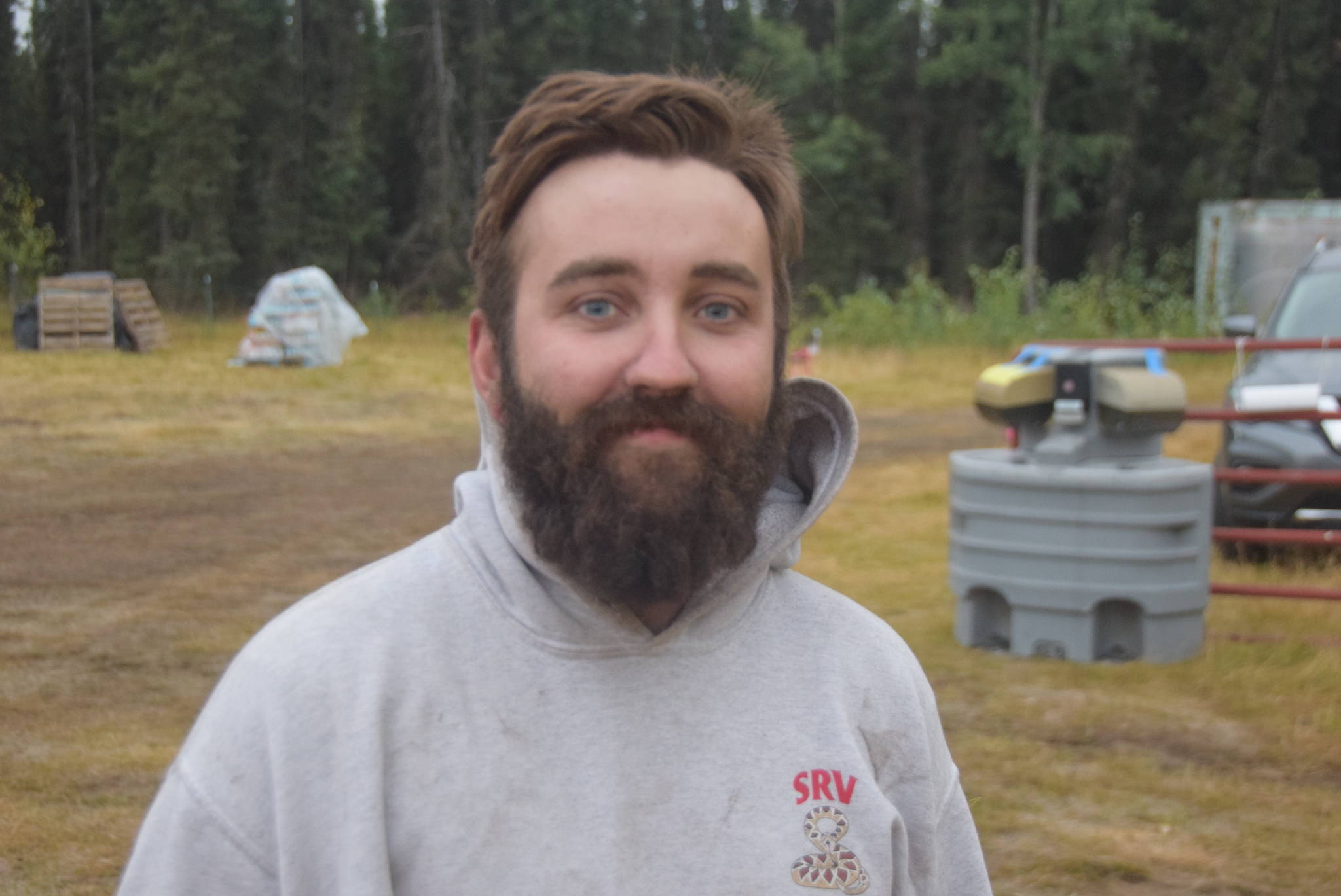 Jacob Mayo, a firefighter from Vale, Oregon, smiles for the camera at the Otter Creek Spike Camp 5 miles north of Sterling, Alaska on Aug. 30, 2019. (Photo by Brian Mazurek/Peninsula Clarion)