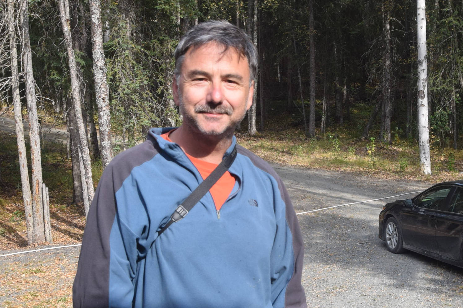 Michael Link, a homeowner in Cooper Landing, Alaska, can be seen here outside his home on Aug. 30, 2019. (Photo by Brian Mazurek/Peninsula Clarion)