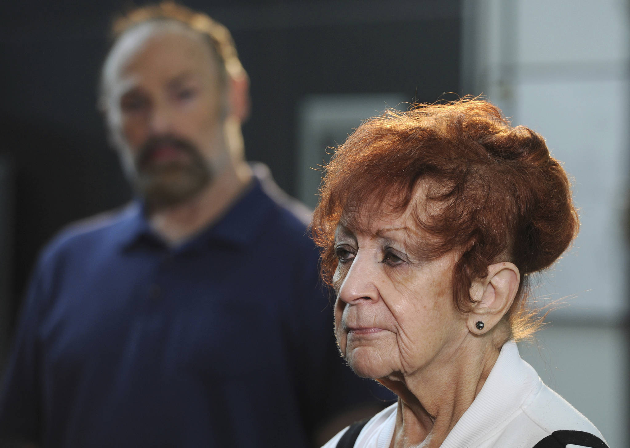 Judy Connolly, mother of murdered teenager Shelley Connolly, spoke to the media after the Alaska State Troopers announced on Tuesday, Sept. 3, 2019, in Anchorage, Alaska, that Oregon resident Donald F. McQuade, 62, has been arrested and charged with murdering Shelley Connolly in the 1978 cold case. She noted it had been 41 years since Shelleys death, which completely altered her familys lives. Shelleys younger brother James Connolly is at left. (Bill Roth/Anchorage Daily News via AP)