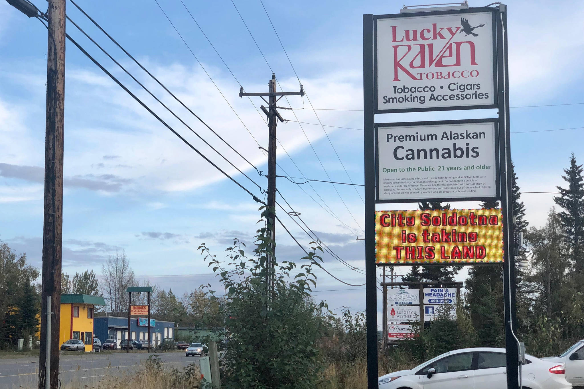 A message opposing annexation is visible on an electronic sign at Lucky Raven Tobacco, located inside one of the proposed areas for annexation, on Thursday, Sept. 5, 2019, near Soldotna, Alaska. The city will host a public hearing on the annexation proposal Saturday, Sept. 7, 2019. (Photo by Victoria Petersen/Peninsula Clarion)