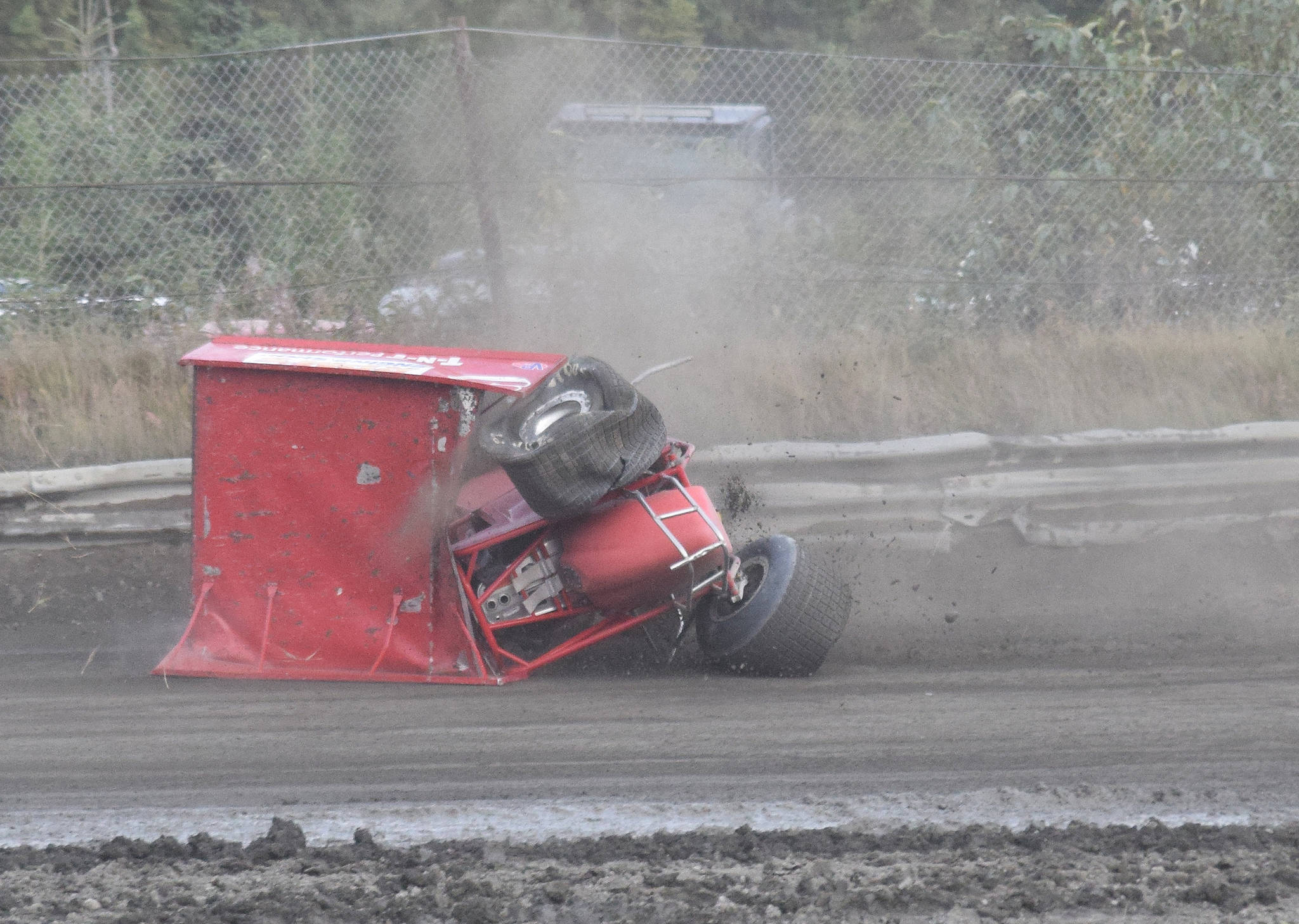 Sprint Car racer John Mellish comes to a rest after a flipping crash Friday, Sept. 6, 2019, at Twin City Raceway in Kenai, Alaska. Mellish was unhurt in the incident. (Photo by Joey Klecka/Peninsula Clarion)