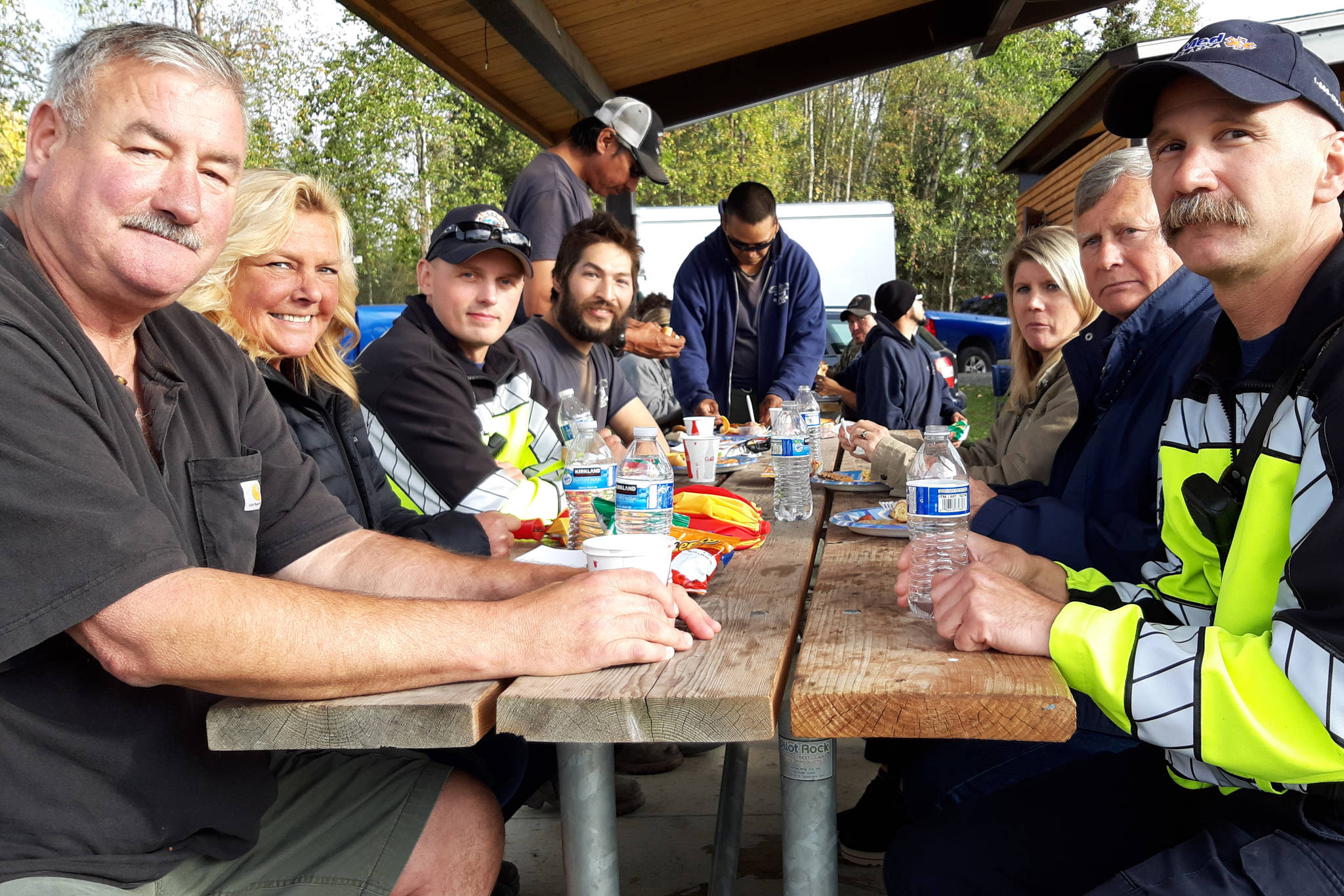 Peninsula residents and firefighters enjoy a meal together during the first responder appreciation barbecue at Soldotna Creek Park on Monday, Sept. 9, 2019, Soldotna, Alaska. (Photo by Brian Mazurek/Peninsula Clarion)