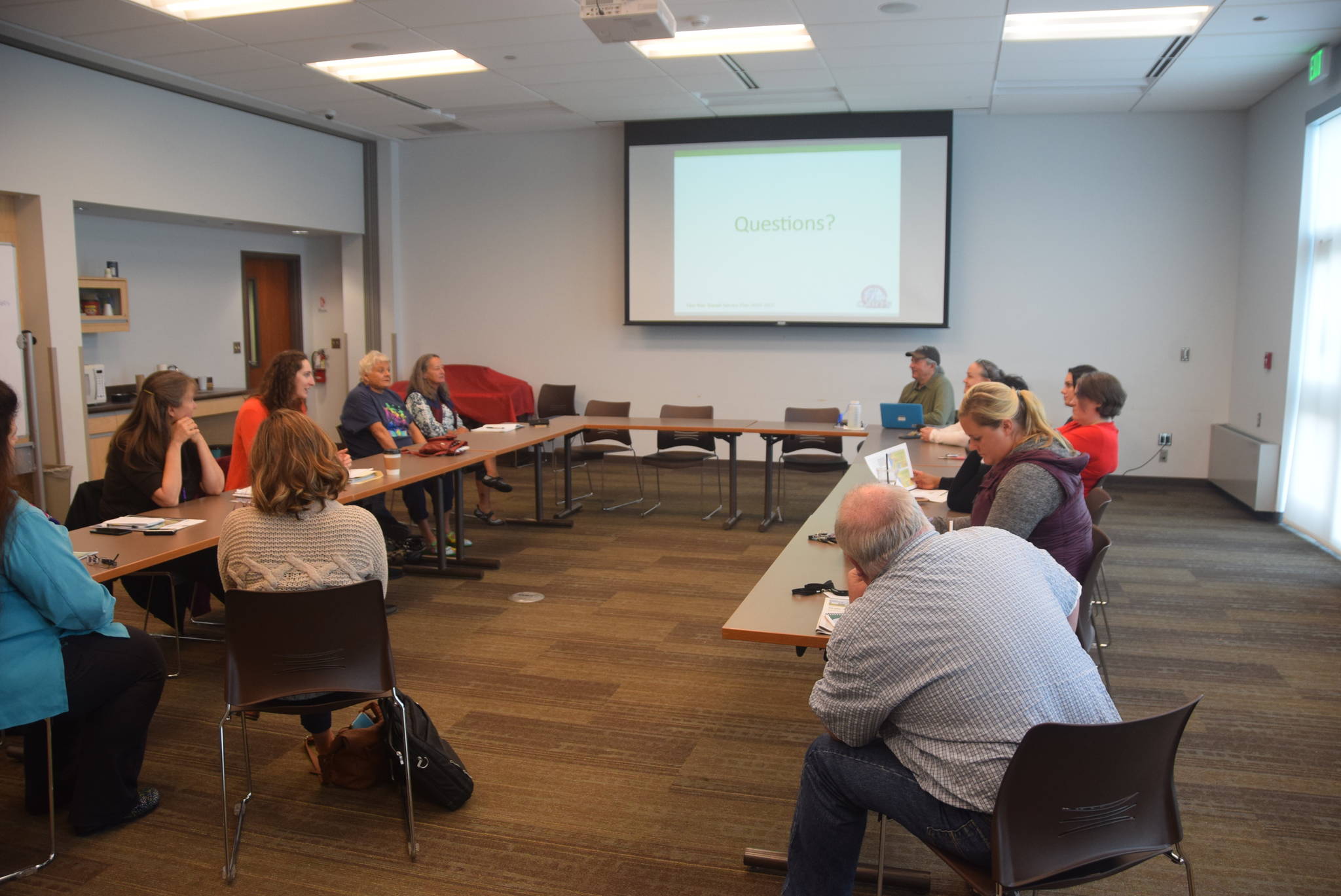 Members of a public transportation workgroup discuss the five-year transit service plan presented by CARTS Executive Director Jennifer Beckmann and board president Gary Katsion at the Soldotna Public Library on Tuesday, Sept. 10, 2019. (Photo by Brian Mazurek/Peninsula Clarion)
