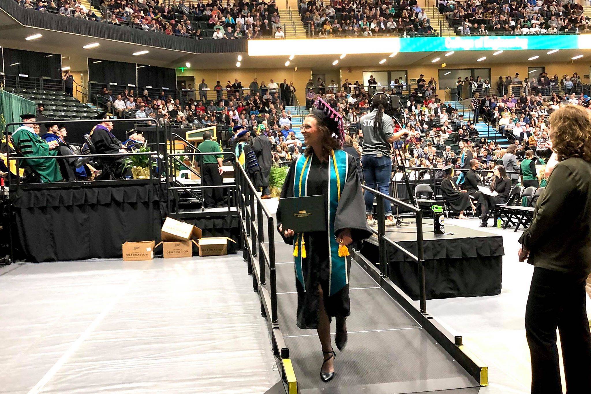 A University of Alaska Anchorage School of Education graduate walks across the stage at University of Alaska Anchorage’s spring 2019 commencement ceremony, the School of Education lost accreditation for all seven of its teacher-preparation programs in January, on May 5, 2019, in Anchorage, Alaska. (Photo by Victoria Petersen/Peninsula Clarion)