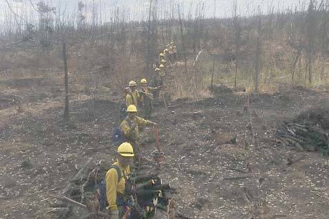 A fire crew can be seen here at a containment line for the Swan Lake Fire in this undated photo. (Courtesy Kenai Peninsula Borough Office of Emergency Management)