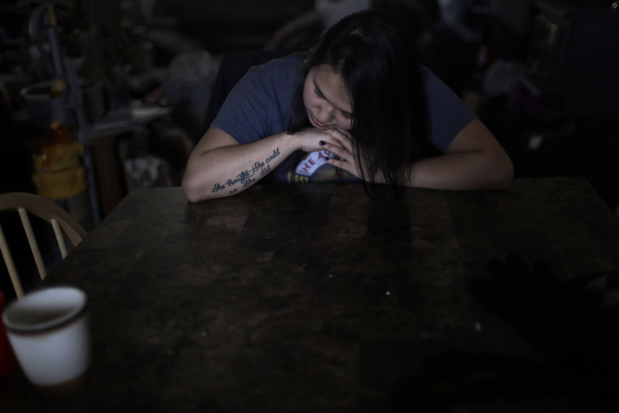 In this Feb. 16, 2019, photo, Deidre Levi rests her head for a moment in her grandmothers house before a basketball game in the Native Village of St. Michael, Alaska. Levi says she spoke up about being sexually assaulted because she wanted to be a role model for girls in Alaska. (AP Photo/Wong Maye-E)