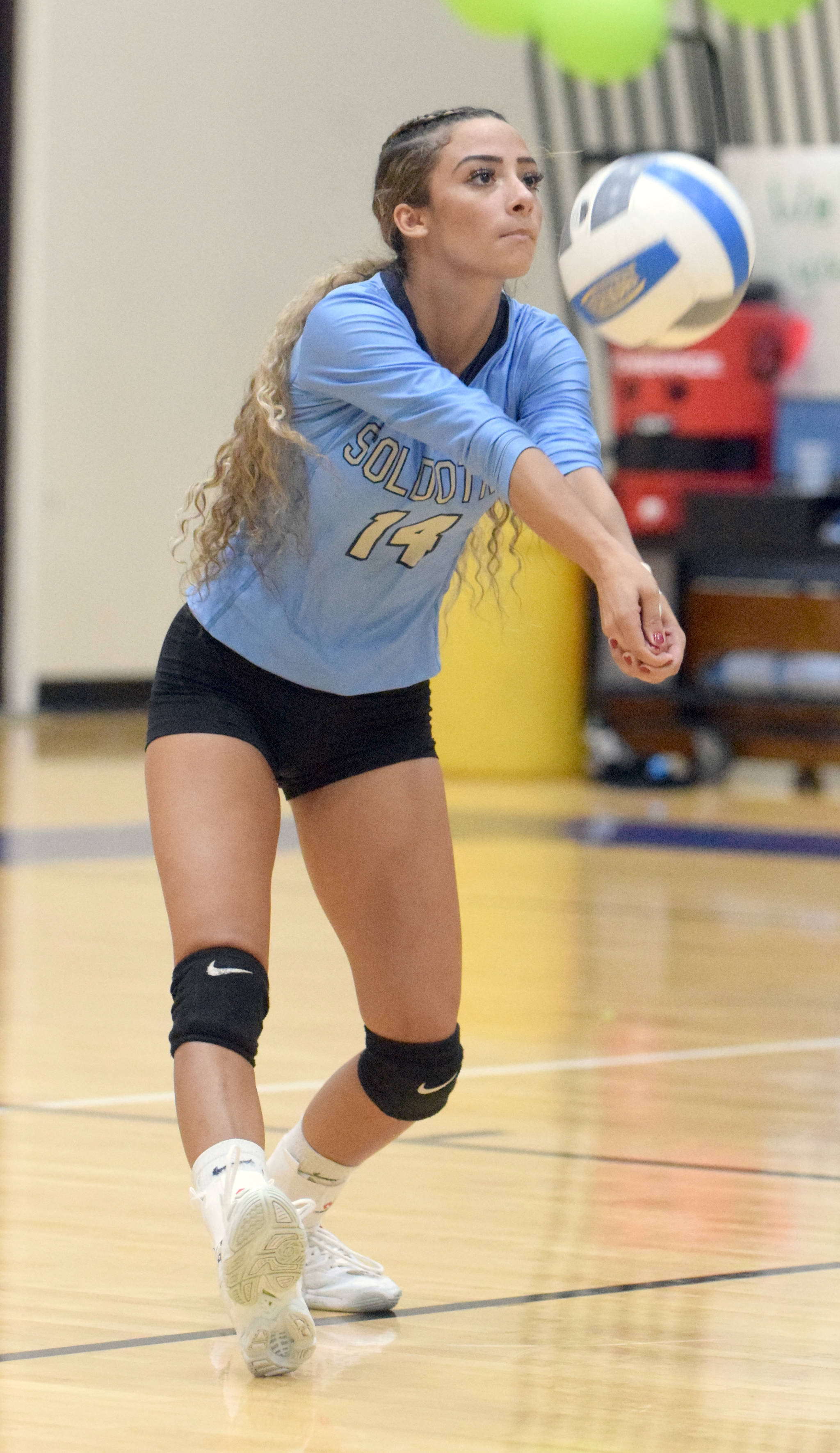 Soldotna’s Holleigh Jaime digs up a ball against Palmer on Friday, Sept. 13, 2019, at Soldotna High School in Soldotna, Alaska. (Photo by Jeff Helminiak/Peninsula Clarion)