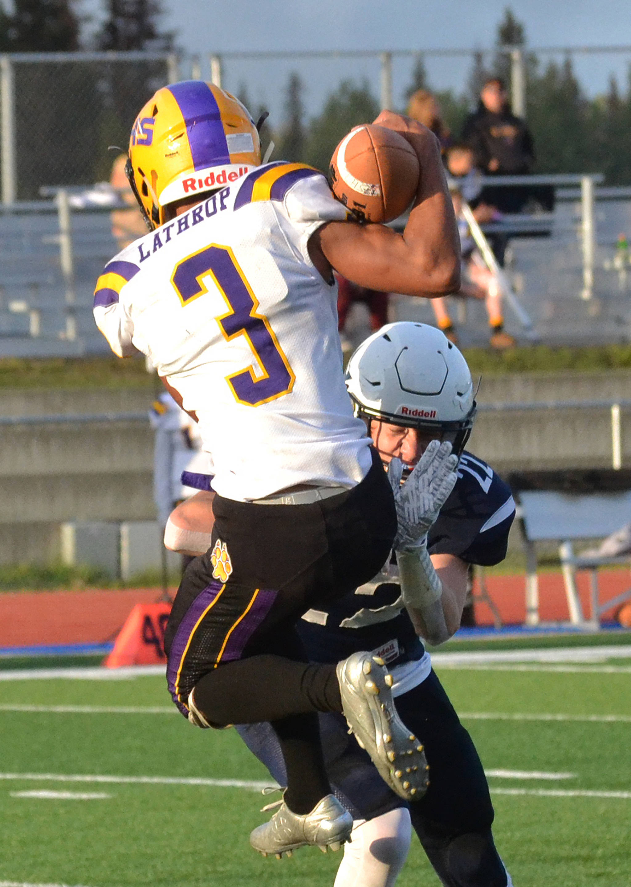 Soldotna’s Ray Chumley tackles Lathrop receiver Jhon Rones (3) Friday, Sept. 13, 2019, at Justin Maile Field in Soldotna, Alaska. (Photo by Joey Klecka/Peninsula Clarion)