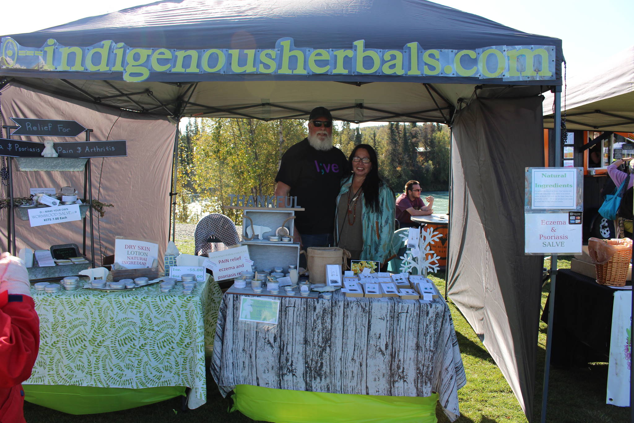 Michael and Tia Holley are seen here at their stand for Indigenous Herbals at the Harvest Moon Local Food Festival at Soldotna Creek Park on Sept. 14, 2019. (Photo by Brian Mazurek/Peninsula Clarion)