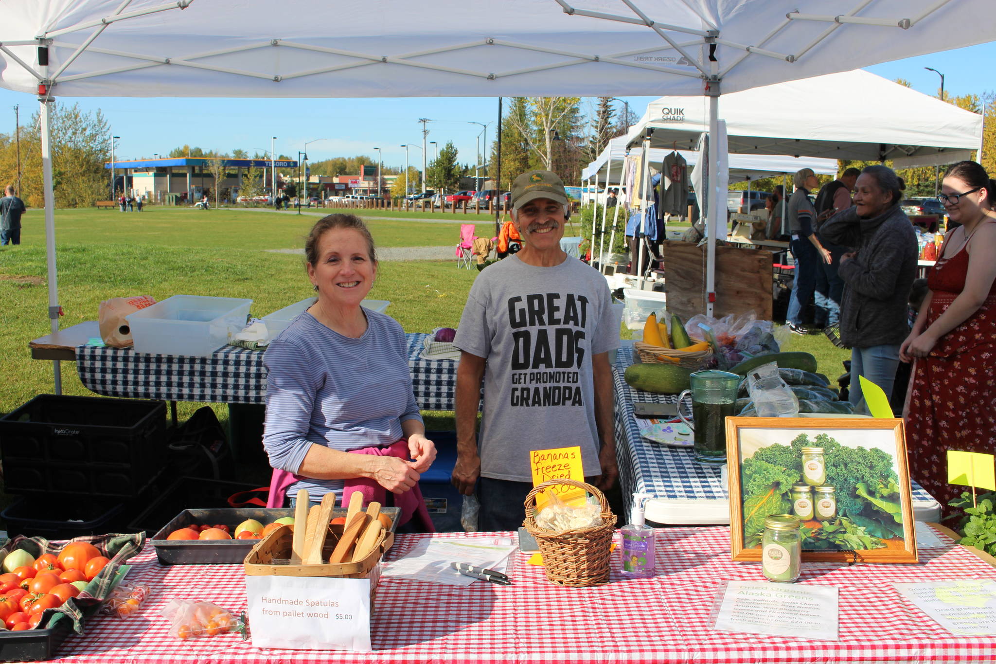 Debbie and Mike Arnold of the Arnold Family Farm show off their products at the Harvest Moon Local Food Festival at Soldotna Creek Park on Sept. 14, 2019. (Photo by Brian Mazurek/Peninsula Clarion)