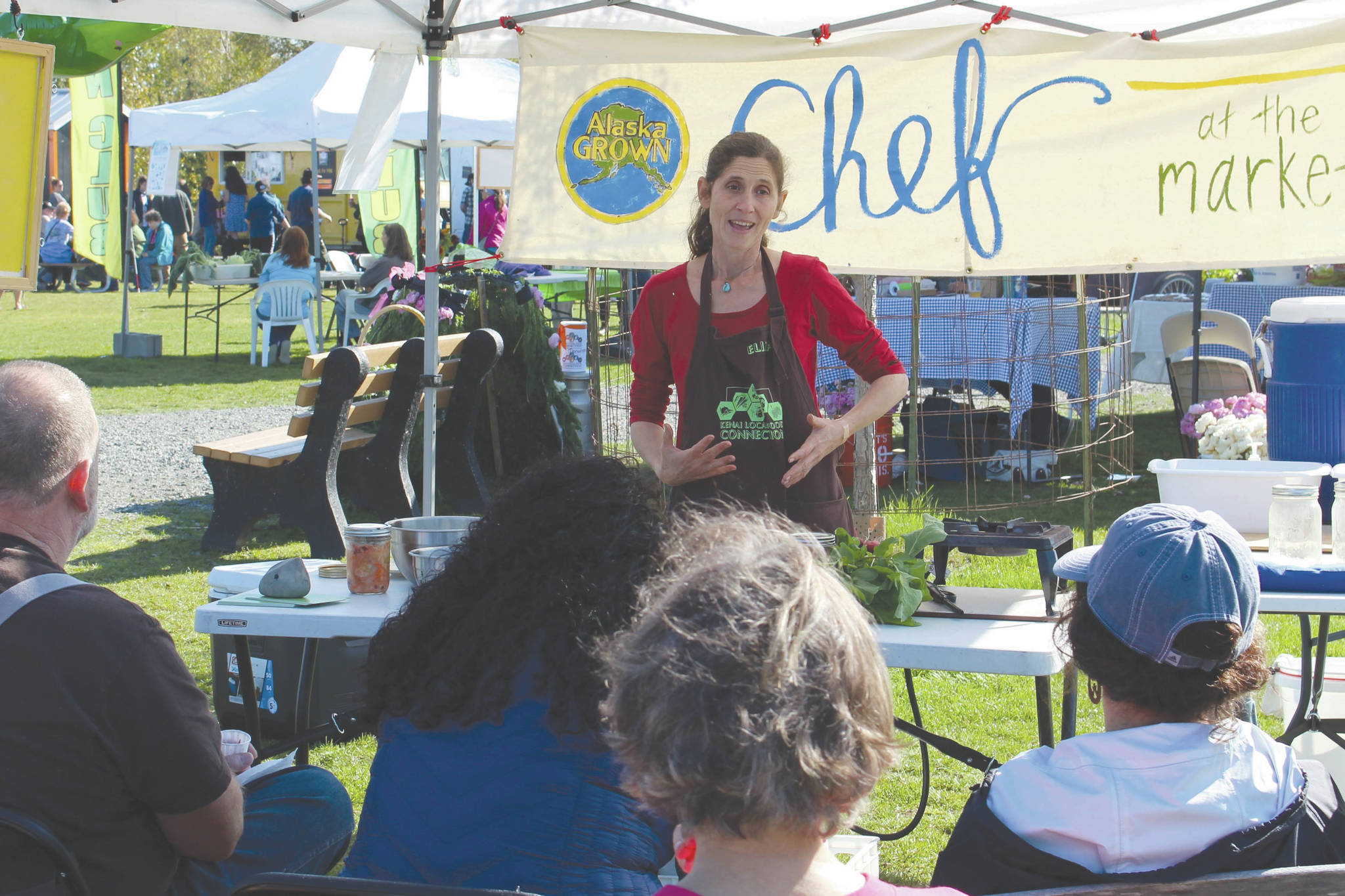 Brian Mazurek / Peninsula Clarion                                Eliza Eller with the Kenai Local Food Connection gives a class on making Kimchi at the Harvest Moon Local Food Festival at Soldotna Creek Park on Saturday.