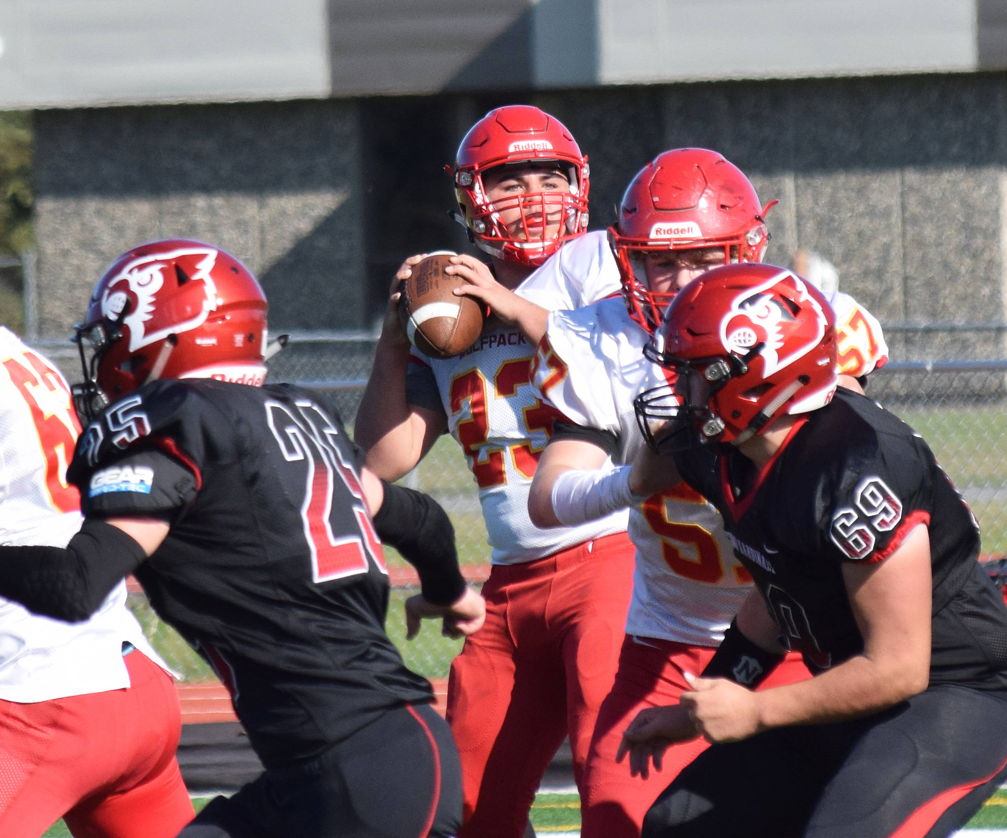 West Valley quarterback Shaun Conwell eyes a receiver downfield Saturday, Sept. 14, 2019, against Kenai Central at Ed Hollier Field in Kenai, Alaska. (Photo by Joey Klecka/Peninsula Clarion)