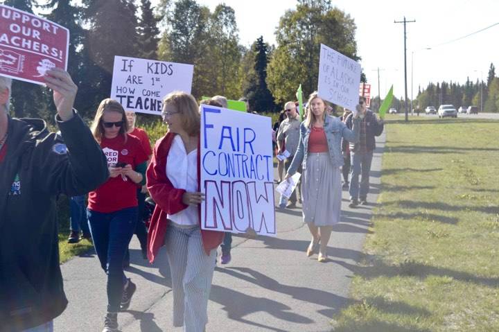 Educators hold signs and rally in front of Kenai Central High School near the Kenai Spur Highway, after school, on Monday, Sept. 16, 2019, in Kenai, Alaska. (Photo by Victoria Petersen/Peninsula Clarion)