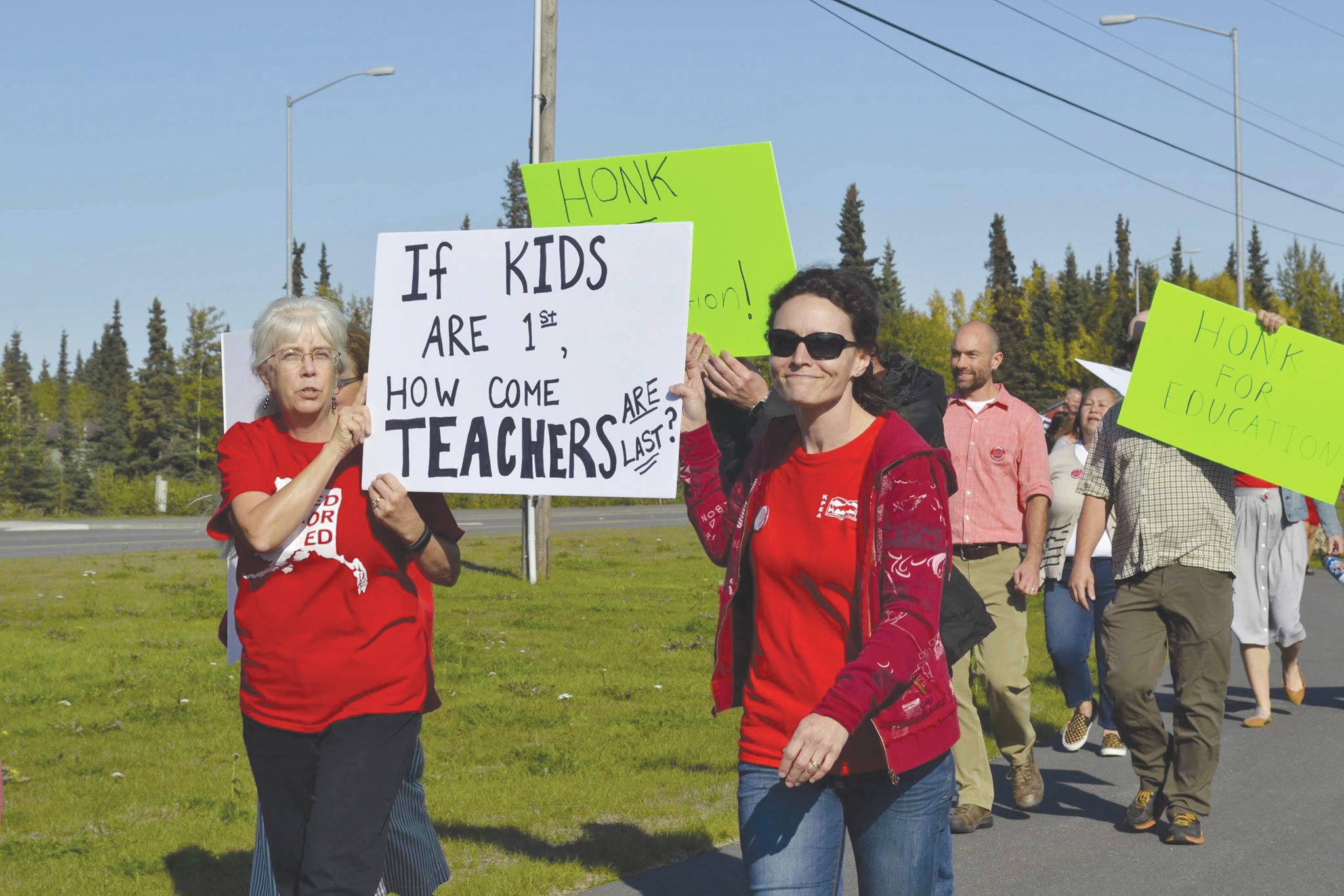 Victoria Petersen / Peninsula Clarion                                 Educators rally Monday in front of Kenai Central High School ahead of a strike slated to begin Tuesday.