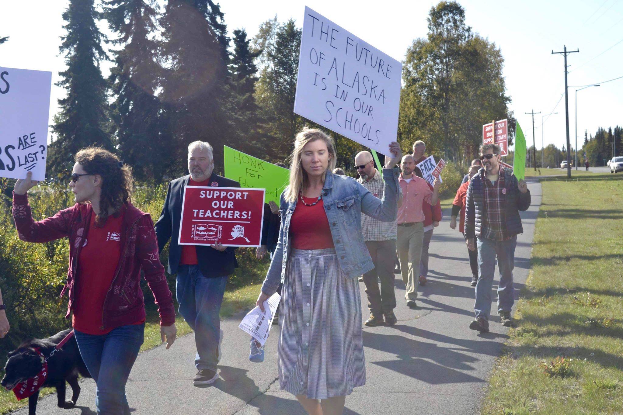 Educators, who are getting ready to strike Tuesday, rally in front of Kenai Central High School, on Monday, Sept. 16, 2019, in Kenai, Alaska. (Photo by Victoria Petersen/Peninsula Clarion)