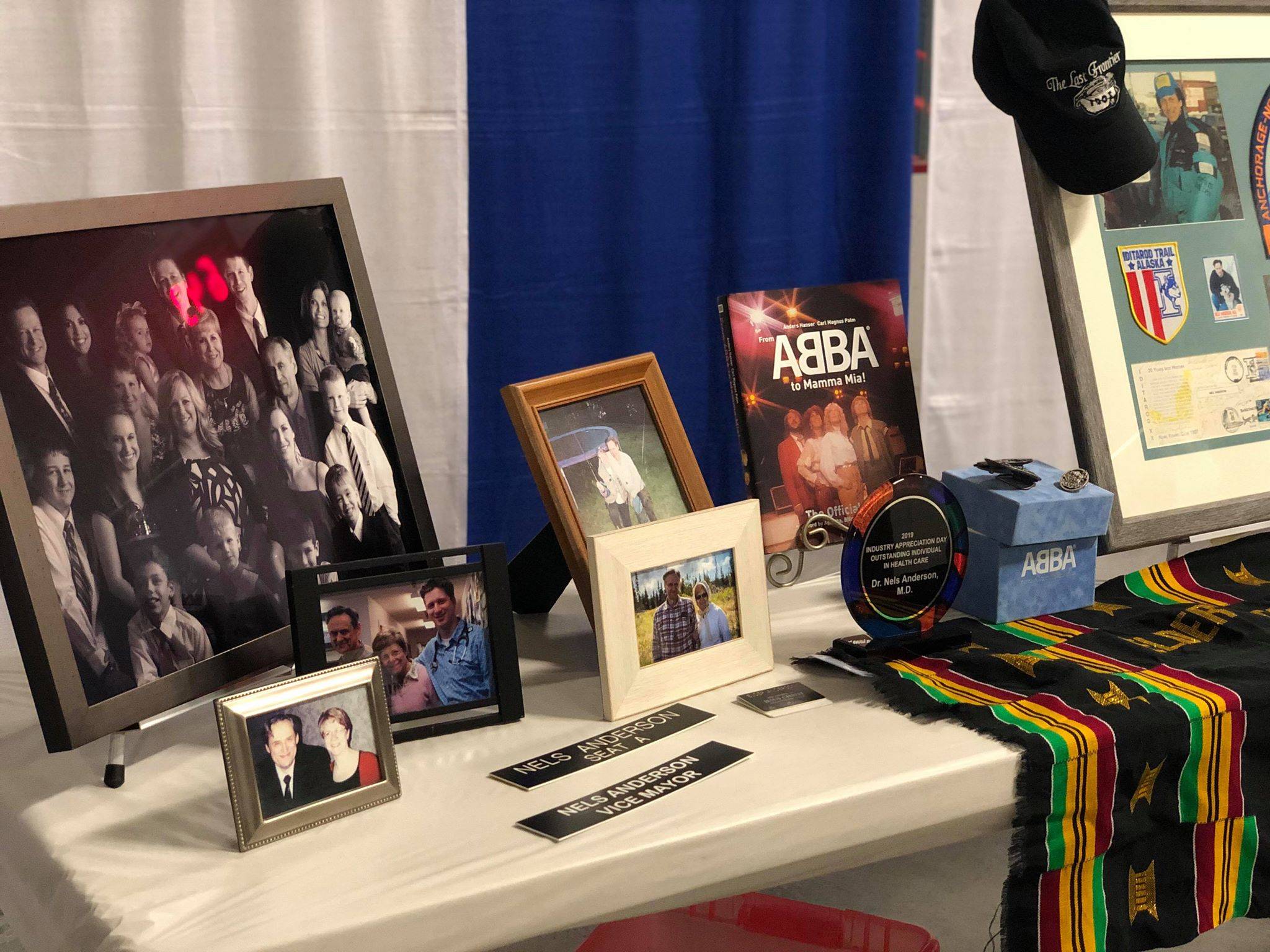 story and photo by Victoria Petersen / Peninsula Clarion                                Memorabilia belonging to the late Dr. John “Nels” Anderson, who was serving as Soldotna’s Mayor, were on display Monday at the Soldotna Regional Sports Complex during a community memorial service.