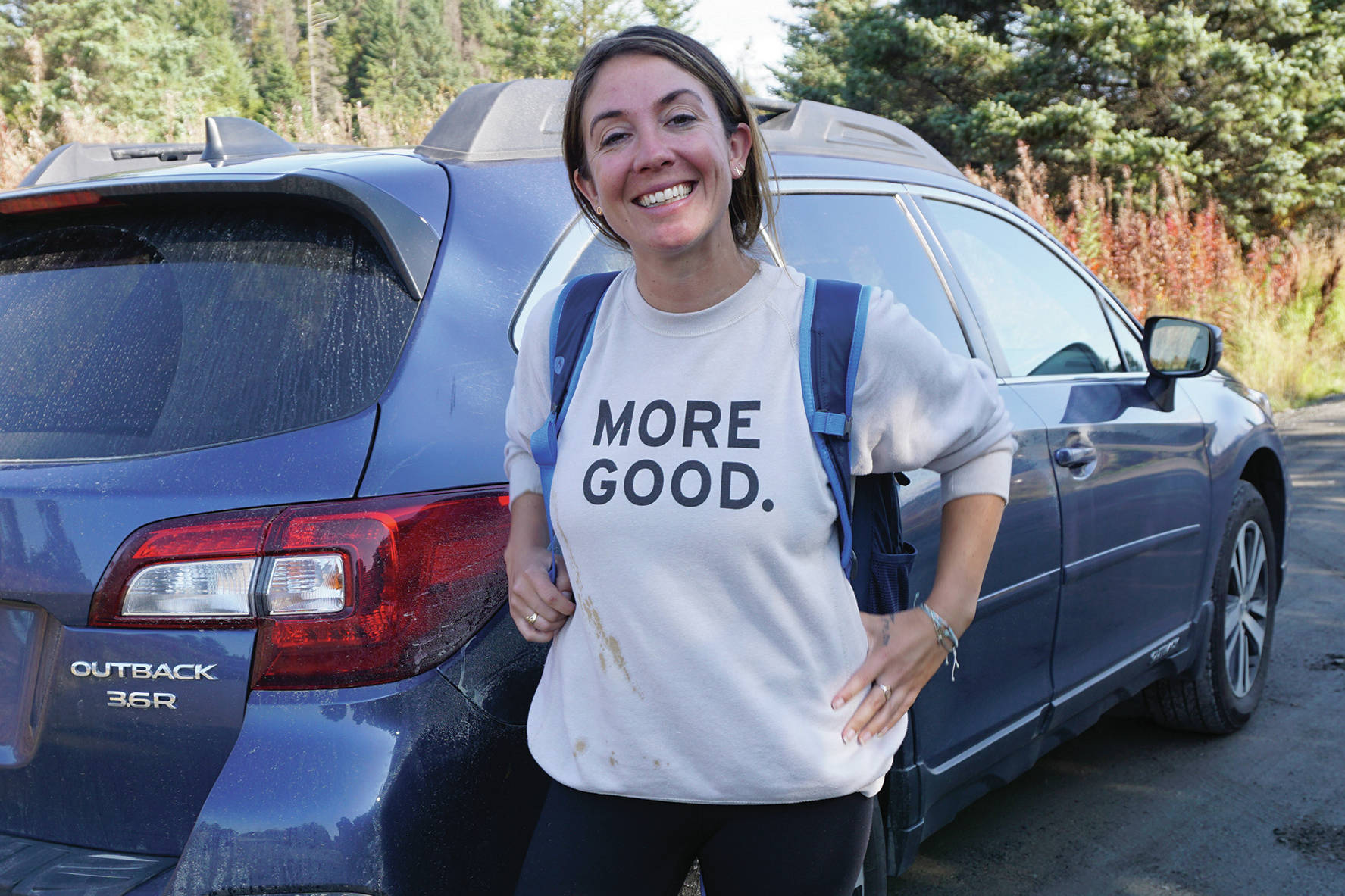 Mary Latham stands by her borrowed blue Subaru Outback on Sept. 16, 2019, in Homer, Alaska. Latham has been touring the United States collecting stories of human kindness to put in a book for people to read in hospital waiting rooms. Alaska is the 48th state Latham has visited since starting her trip in September 2016. (Photo by Michael Armstrong/Homer News)