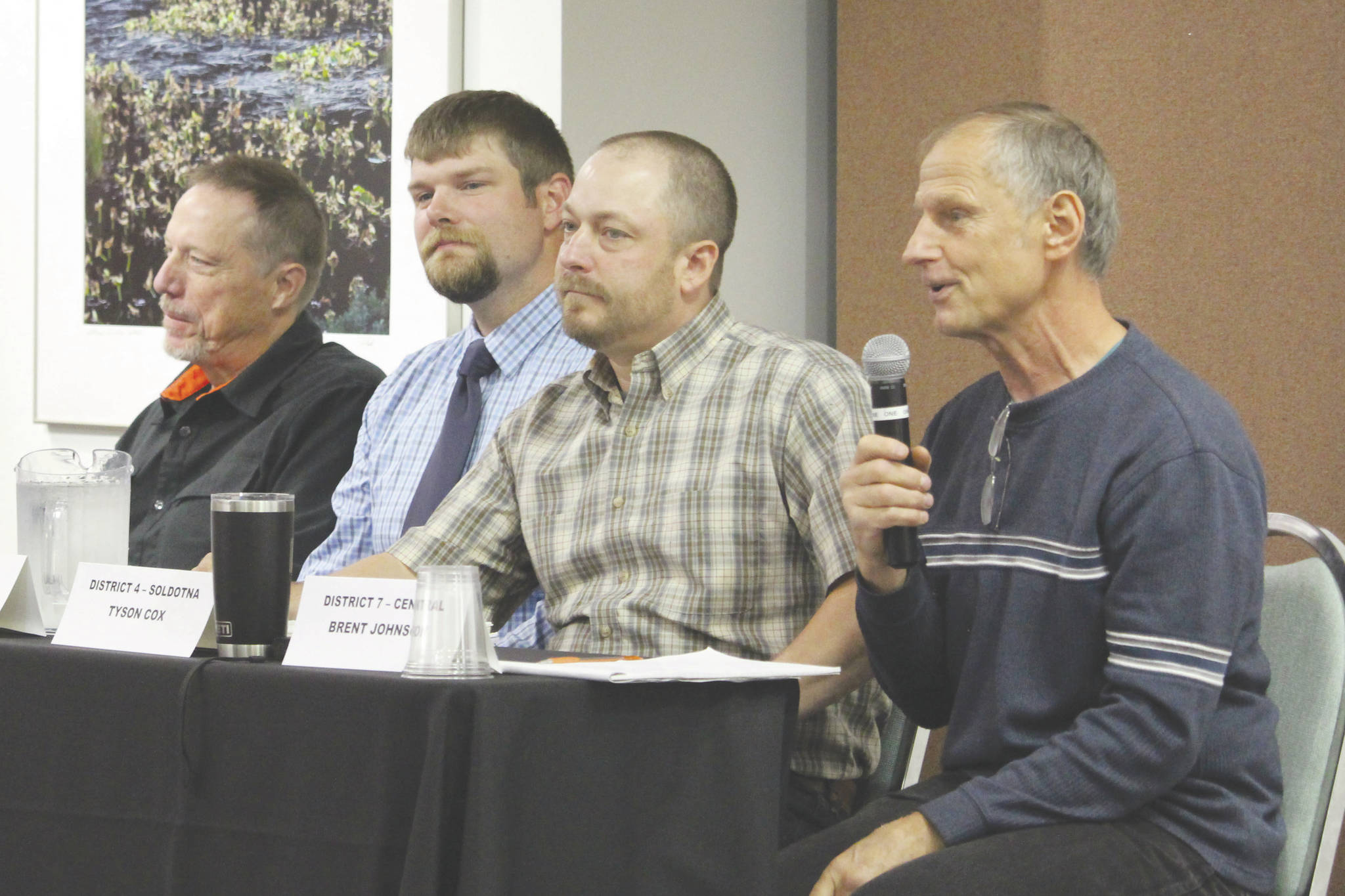 From left, Kenai Peninsula Borough Assembly candidates Joseph Ross, Jesse Bjorkman, Tyson Cox and Brent Johnson speak to members of the Kenai and Soldotna Chambers of Commerce at the Kenai Visitor’s Center on Wednesday. (Photo by Brian Mazurek/Peninsula Clarion)