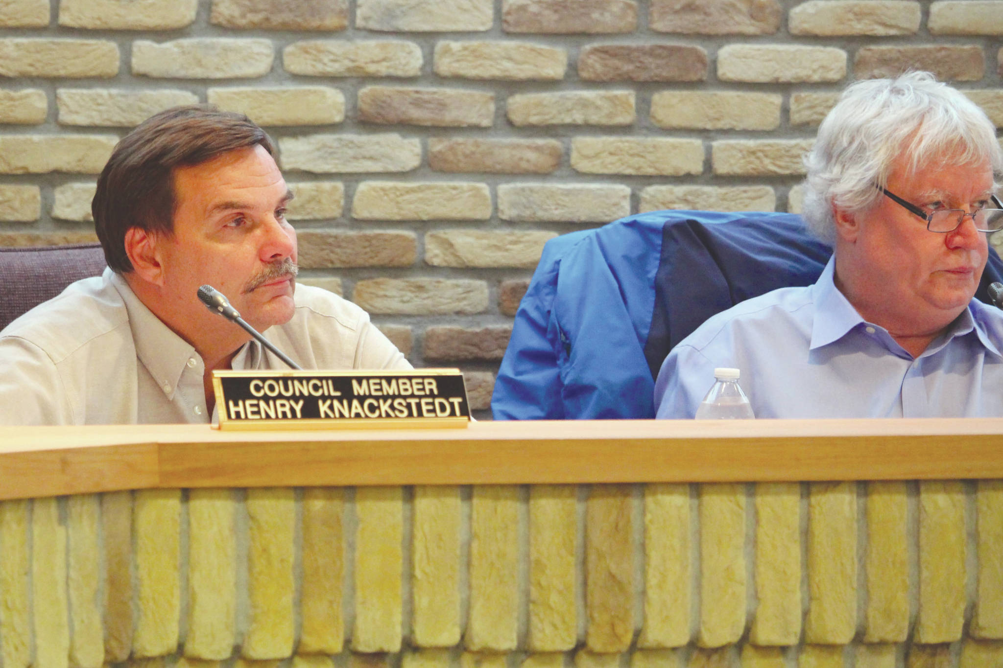 Kenai City Council Members Henry Knackstedt, left, and Bob Molloy, right, listen to public comments during the Kenai City Council Meeting on Wednesday, Sept. 18, 2019. (Photo by Brian Mazurek/Peninsula Clarion)