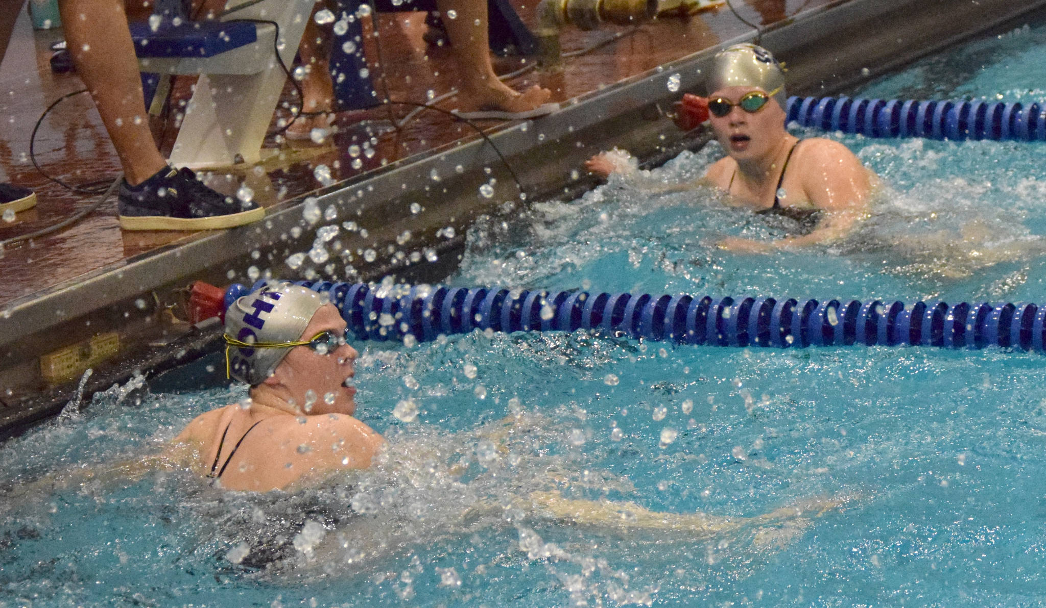 Soldotna High School’s Madison Snyder and Katie Creglow touch the wall in the 50-yard freestyle Friday, Sept. 20, 2019, in the 2019 SoHi Pentathlon at Soldotna High School in Soldotna, Alaska. (Photo by Jeff Helminiak/Peninsula Clarion)
