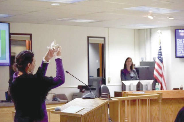 Members of the Kenai Peninsula Borough Assembly hold a religious invocation during the Tuesday, Oct. 9, 2018, assembly meeting in Soldotna. The invocation was held only hours after the Alaska Superior Court ruled the ritual violated the Alaska Constitution. (Photo by Victoria Petersen/Peninsula Clarion)