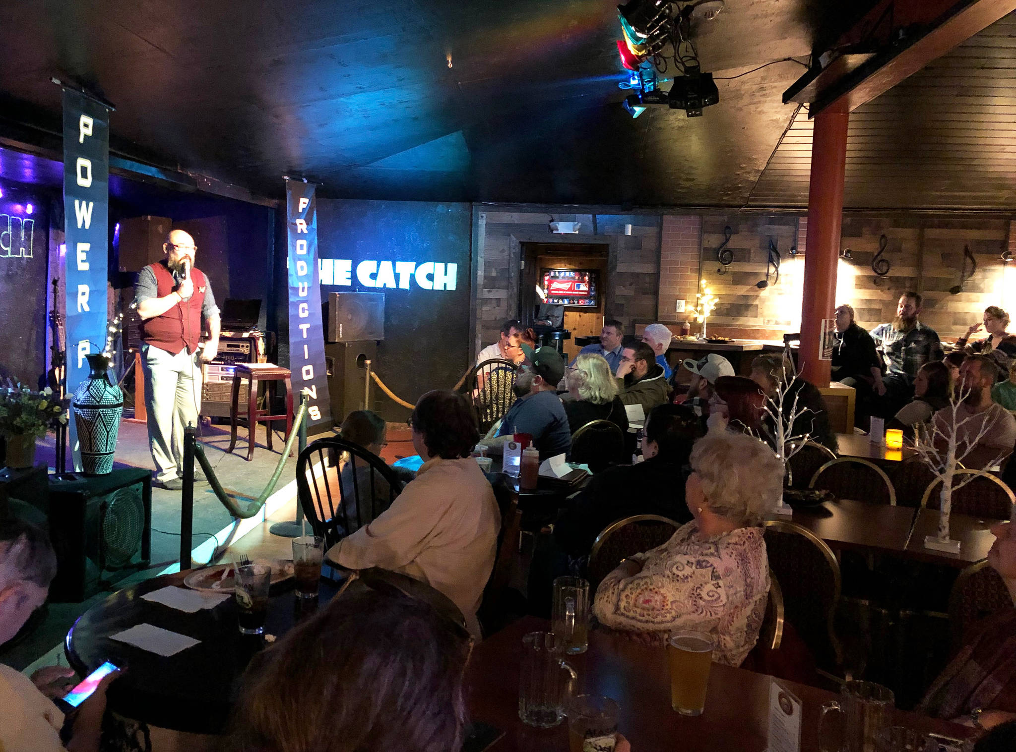 Photos by Joey Klecka / Peninsula Clarion                                Stand-up comedian Fred Koski performs his act Friday during “Comedy at The Catch” at The Catch restaurant in Soldotna.
