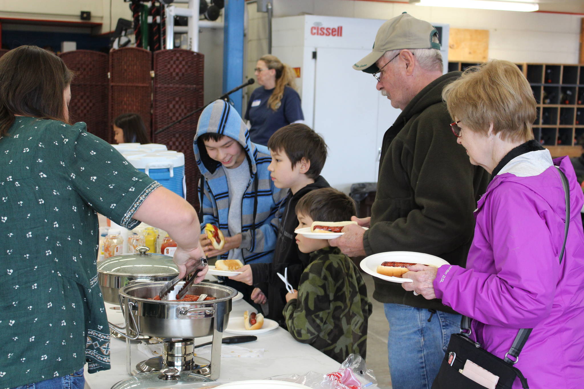 Visitors the fire station grab some free food during the Central Emergency Services Open House at Fire Station 1 in Soldotna, Alaska on Sept. 28, 2019. (Photo by Brian Mazurek/Peninsula Clarion)