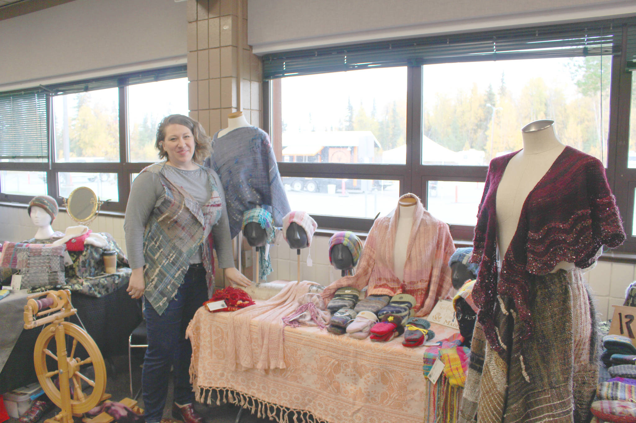 Farrah Weinert shows off some of her wares during the Fireweed FiberFest at the Soldotna Regional Sports Complex on Sept. 28, 2019. (Photo by Brian Mazurek/Peninsula Clarion)