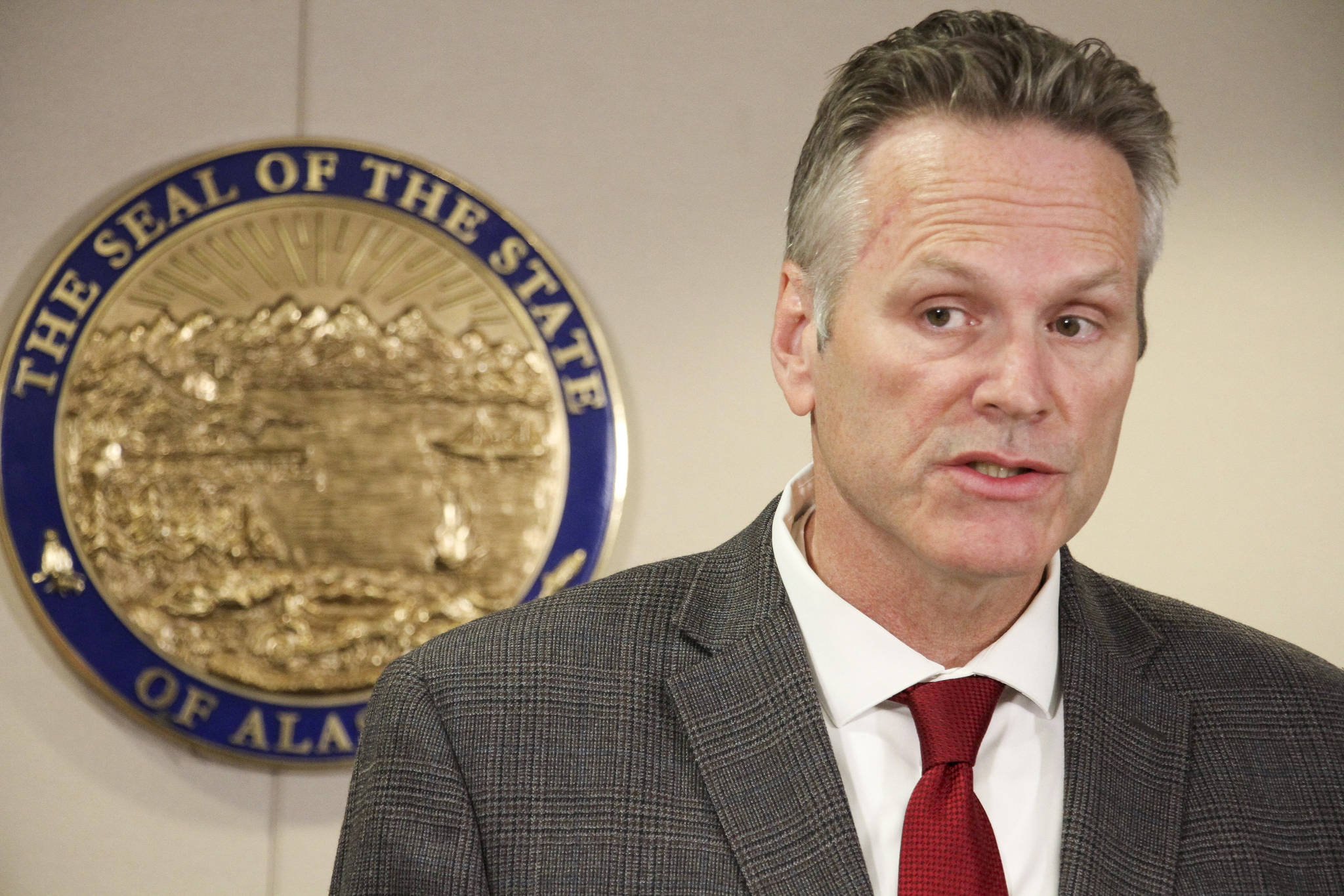 Alaska Gov. Mike Dunleavy announces the nomination of state Rep. Josh Revak to an open state Senate seat during a news conference Friday, Sept. 27, 2019, in Anchorage, Alaska. Dunleavy’s first choice for the seat, Rep. Laddie Shaw, was rejected by Senate Republicans, who now will consider Revak’s nomination. (AP Photo/Mark Thiessen)