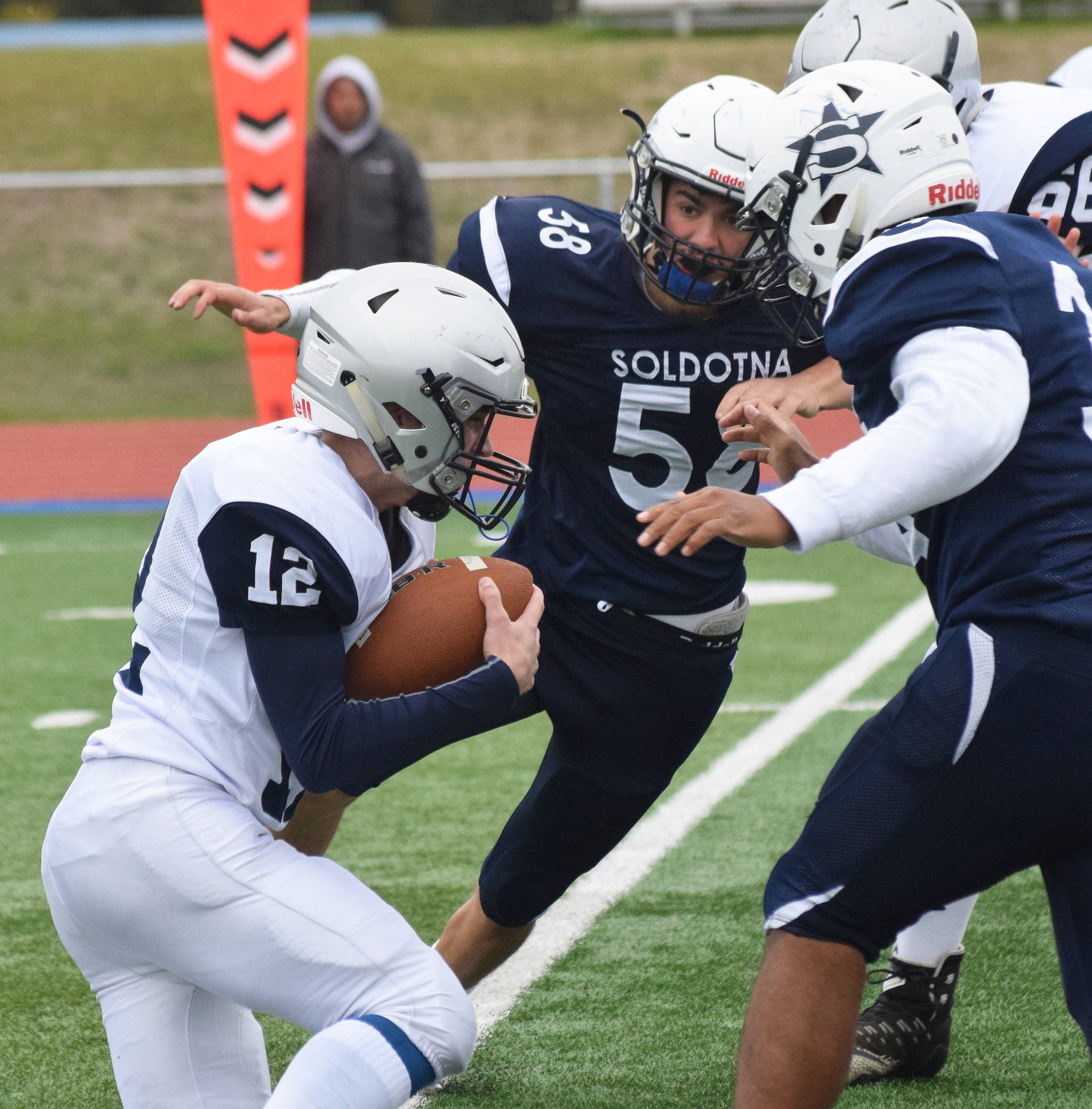 Soldotna’s Zack Ziegler rushes Eagle River quarterback Nathaniel Guderian, Saturday, Sept. 28, 2019, against Eagle River at Justin Maile Field in Soldotna. (Photo by Joey Klecka/Peninsula Clarion)