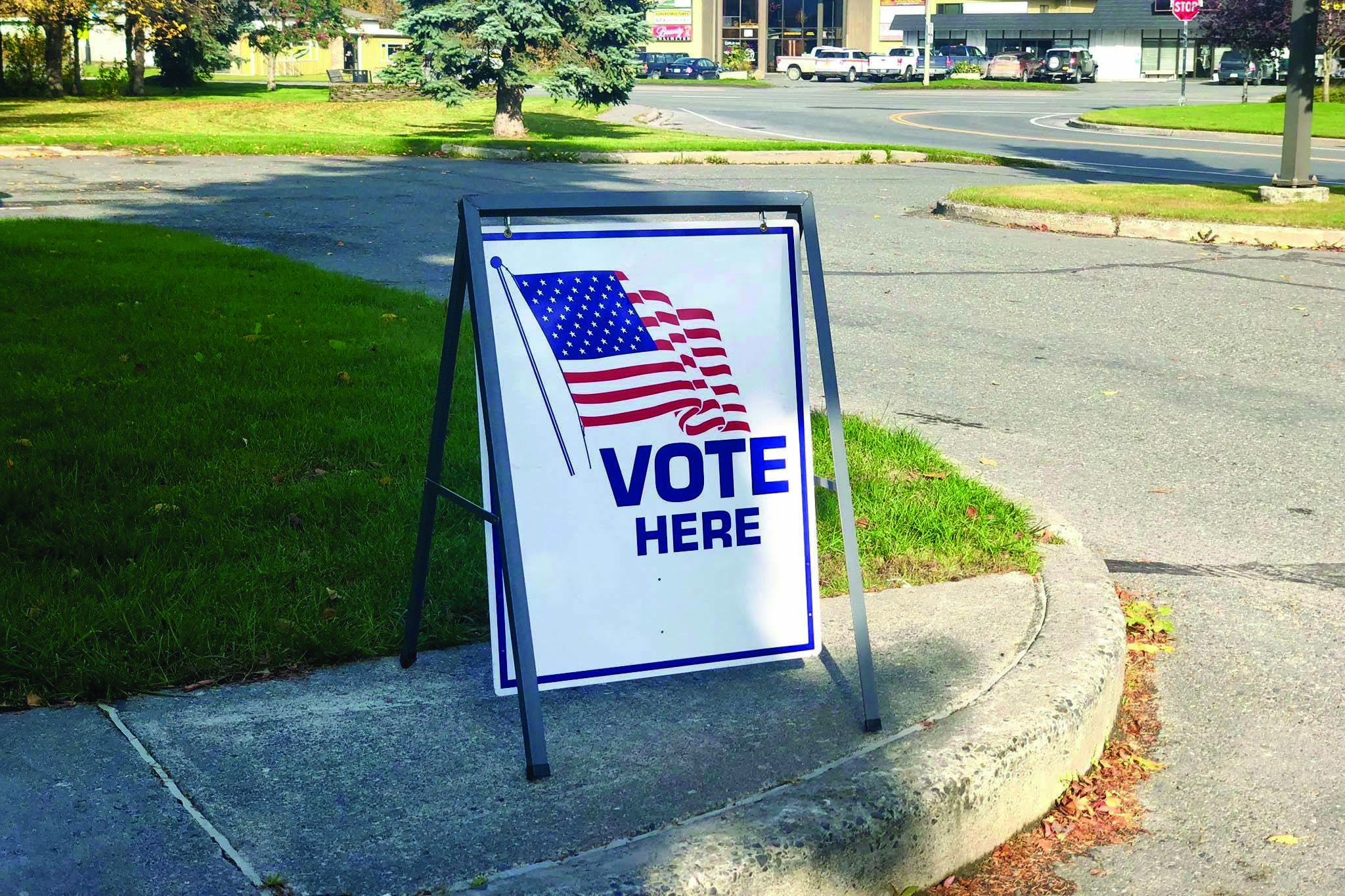 A sign directing voters to the polls stands outside Soldotna City Hall on Tuesday, Oct. 1, 2019. (Photo by Victoria Petersen/Peninsula Clarion)
