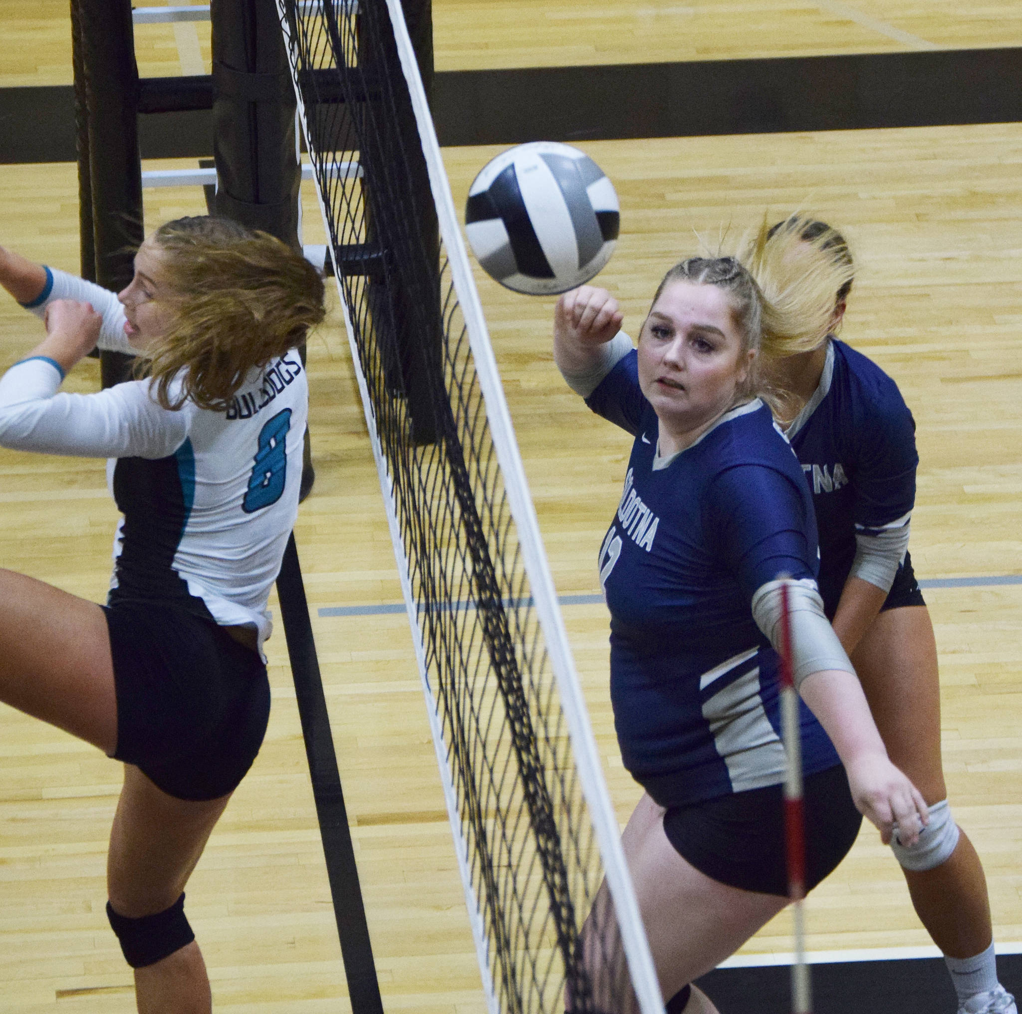 Soldotna’s Bailey Armstrong deflects a ball from Nikiski’s Kaitlyn Johnson, Tuesday, Oct. 1, 2019, at Nikiski High School in Nikiski, Alaska. (Photo by Joey Klecka/Peninsula Clarion)