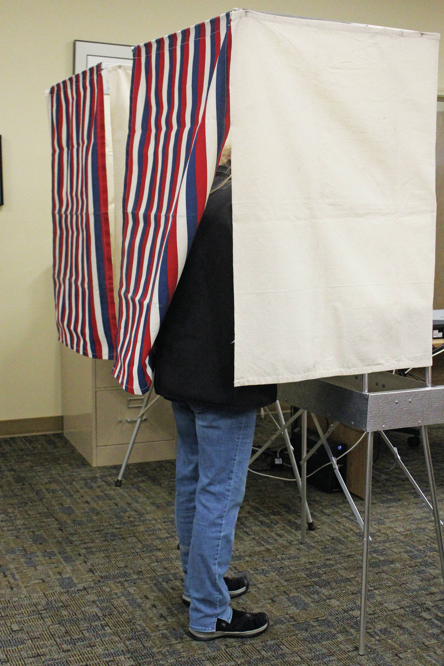 A Homer city resident casts their vote in the Tuesday, Oct. 1, 2019 municipal election at Homer City Hall in Homer, Alaska. (Photo by Megan Pacer/Homer News)