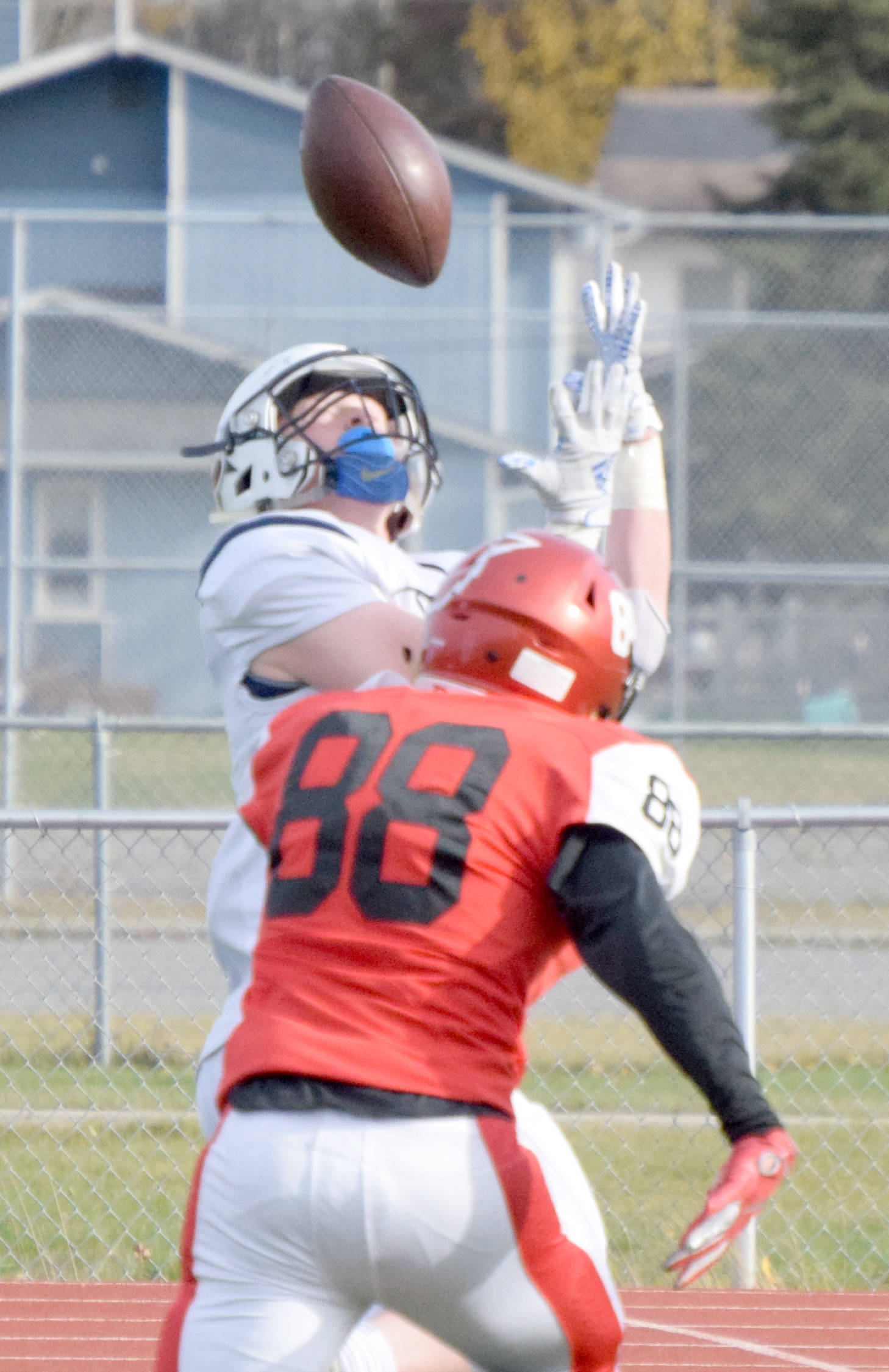 Soldotna’s Galen Brantley III catches a touchdown over Kenai Central’s Braedon Pitsch on Saturday, Oct. 5, 2019, at Ed Hollier Field at Kenai Central High School in Kenai, Alaska. (Photo by Jeff Helminiak/Peninsula Clarion)