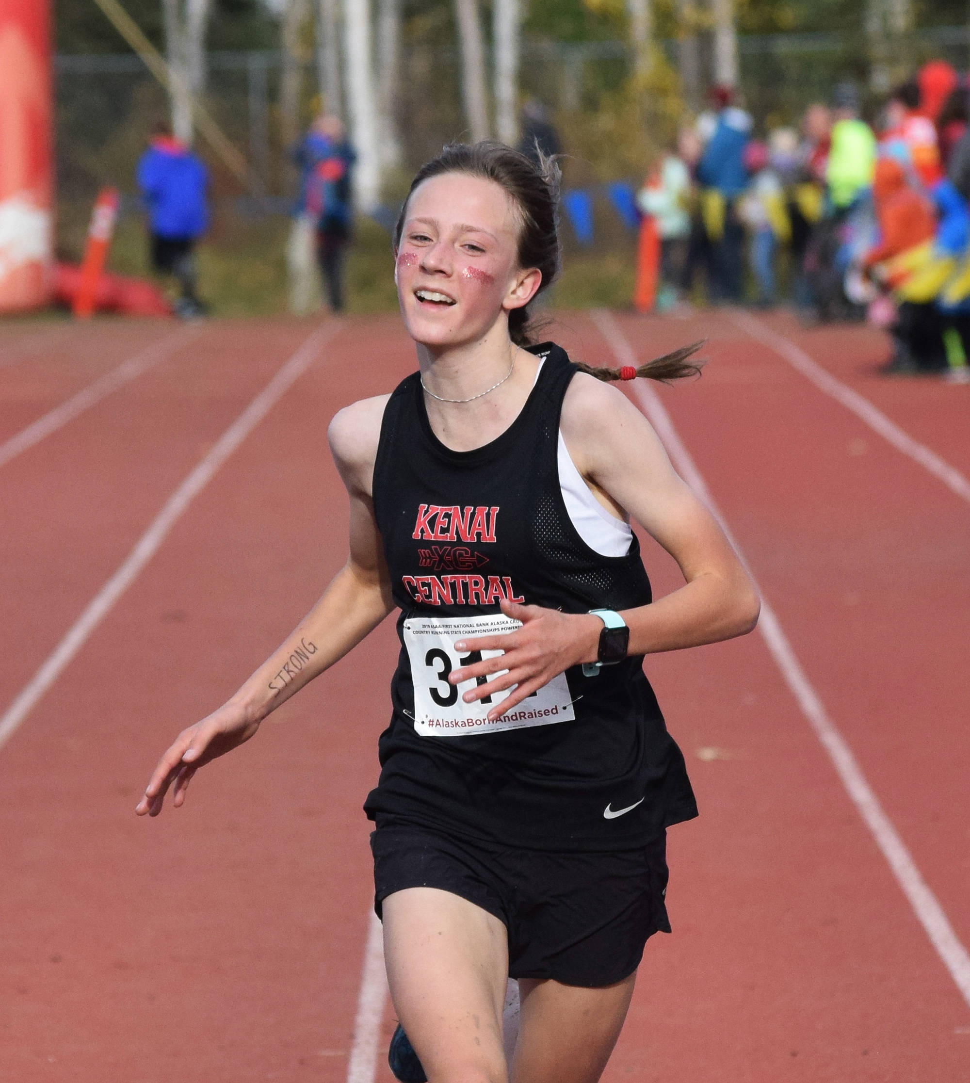 Kenai’s Jayna Boonstra crosses the finish of the Div. II girls state cross-country championships Saturday, Oct. 5, 2019, on the Bartlett High trails in Anchorage, Alaska. (Photo by Joey Klecka/Peninsula Clarion)