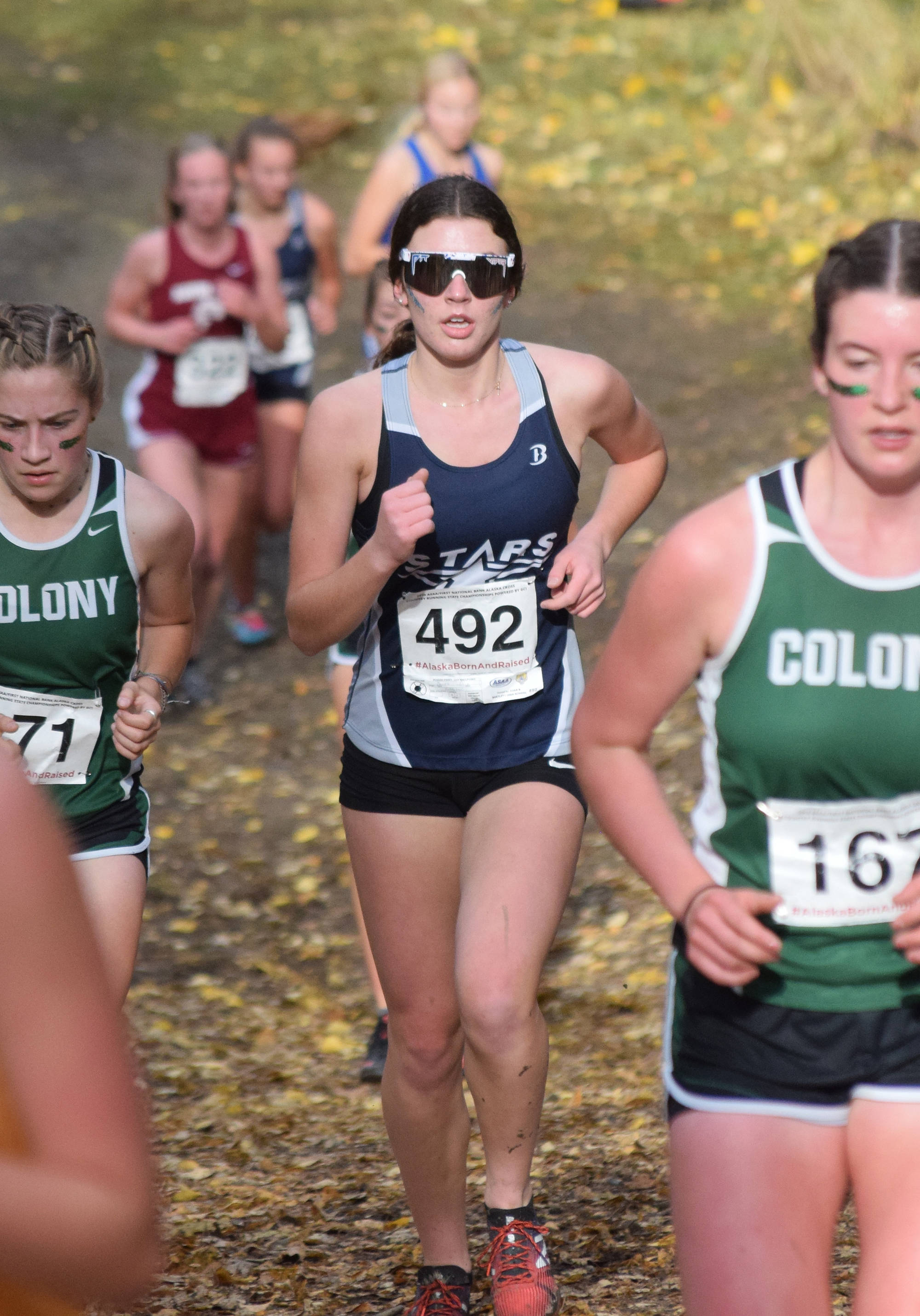 Soldotna’s Ellie Burns tackles a hill at the Div. I girls state cross-country championships Saturday, Oct. 5, 2019, on the Bartlett High trails in Anchorage, Alaska. (Photo by Joey Klecka/Peninsula Clarion)