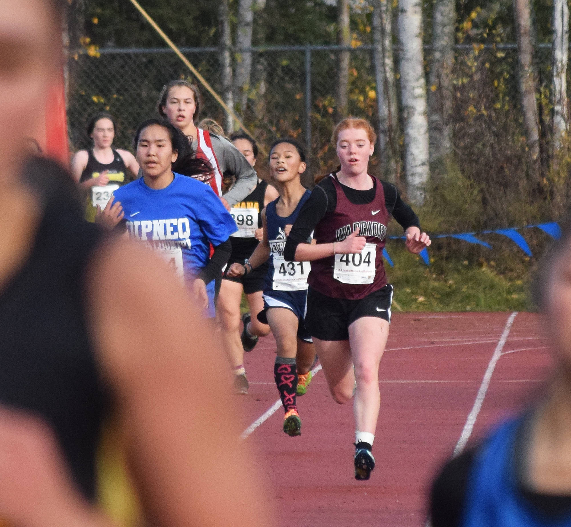 Nikolaevsk’s Isabella Hickman approaches the finish of the Div. III girls state cross-country championships Saturday, Oct. 5, 2019, on the Bartlett High trails in Anchorage, Alaska. (Photo by Joey Klecka/Peninsula Clarion)