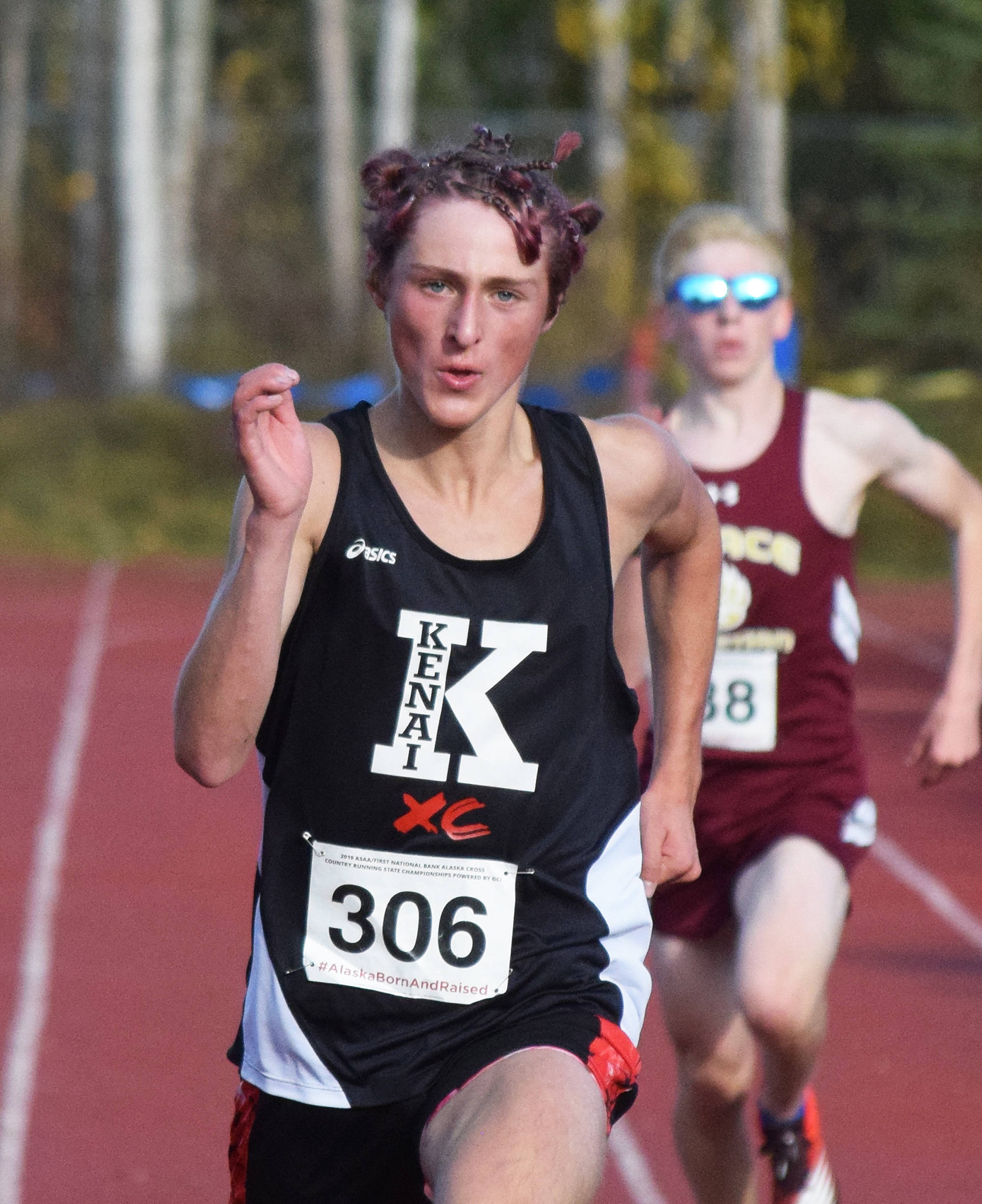 Kenai’s Maison Dunham runs to a third-place finish in the Div. II boys state cross-country championships Saturday, Oct. 5, 2019, on the Bartlett High trails in Anchorage, Alaska. (Photo by Joey Klecka/Peninsula Clarion)