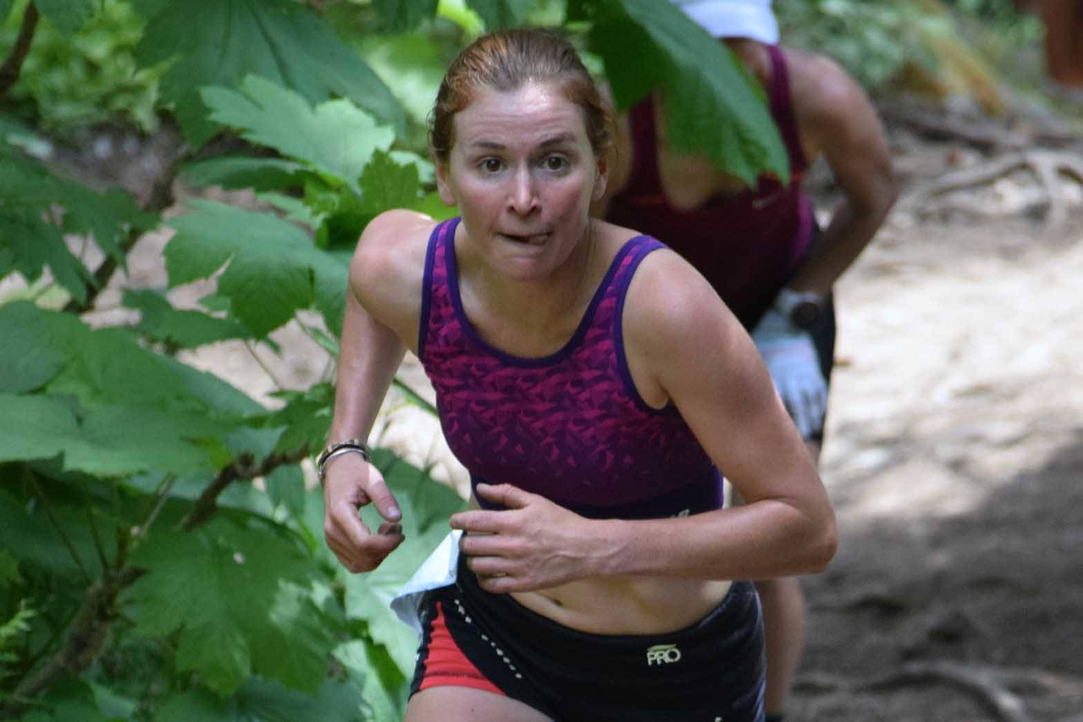 Hannah Lafleur of Seward, Alaska, runs at the top of the cliffs at the Mount Marathon Race on Wednesday, July 4, 2018, in Seward. (Photo by Jeff Helminiak/Peninsula Clarion)