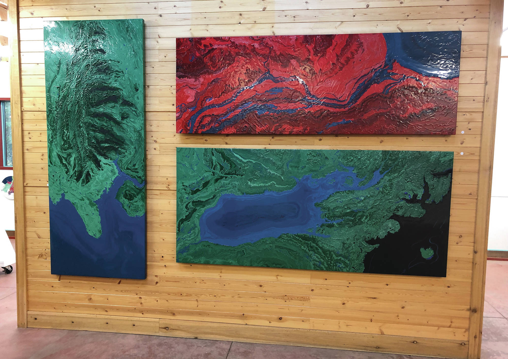 Paintings by Spelman Evans Downer sit on display at the Ecotopia North Painting Exhibition at the Gallery Turquoise North at mile 49.5 of the Sterling Highway in Cooper Landing. (Photo provided by Sara Frantz)
