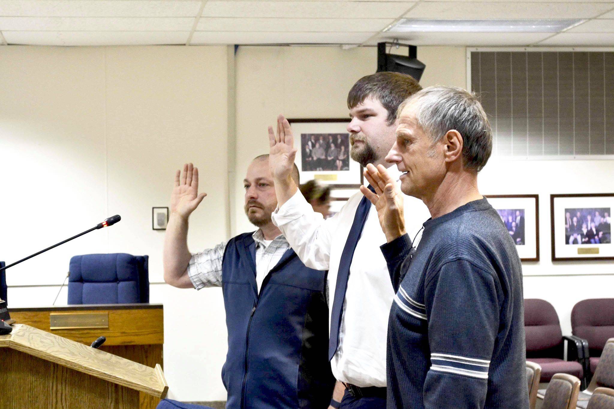 Victoria Petersen / Peninsula Clarion                                Newly elected assembly members Tyson Cox, Jesse Bjorkman and Brent Johnson are sworn in during Tuesday’s Kenai Peninsula Borough Assembly meeting in Soldotna.