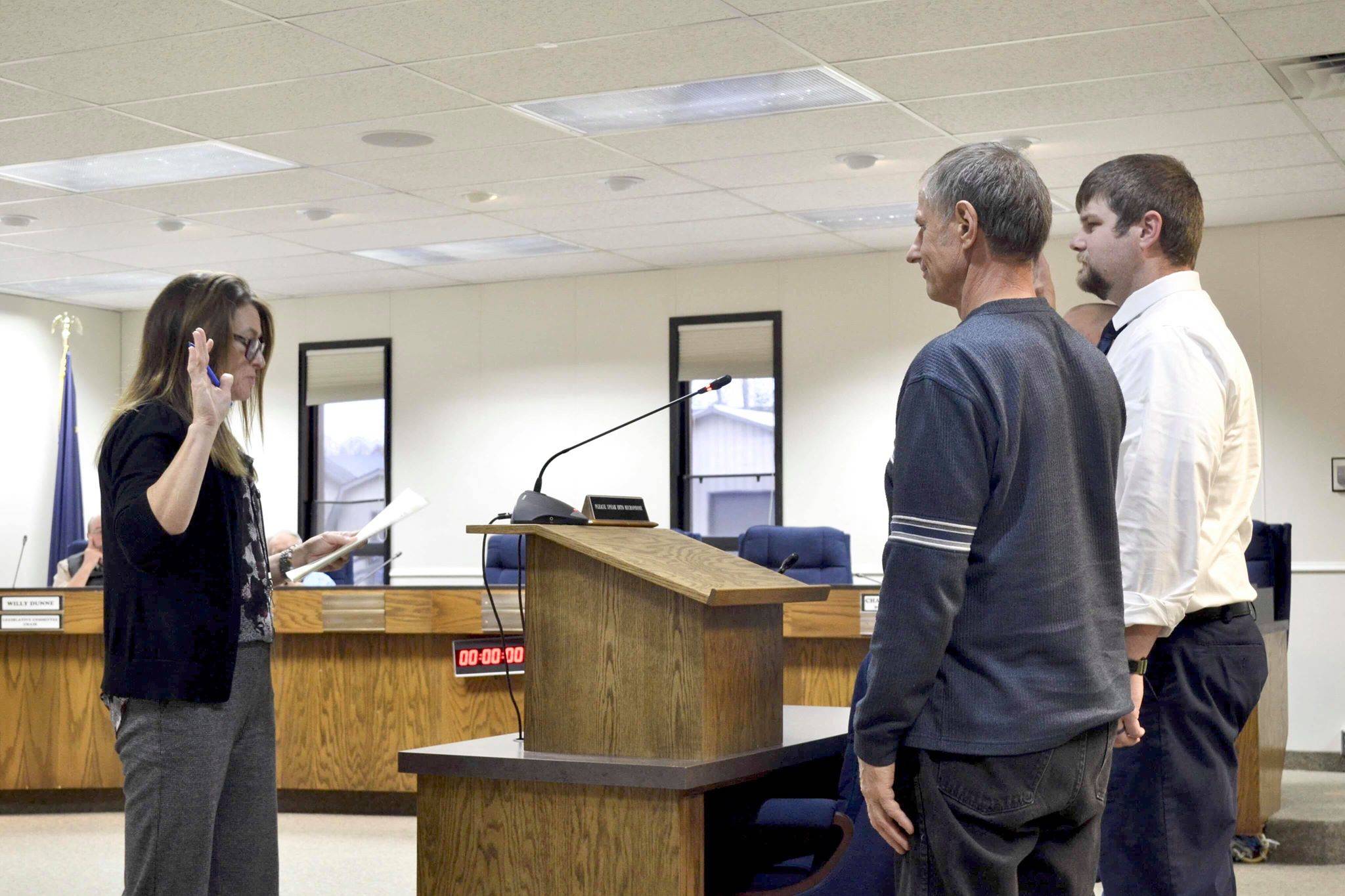 Kenai Peninsula Borough clerk swears in the newly elected assembly members, Tyson Cox, Jesse Bjorkman and Brent Johnson, during Tuesday’s Kenai Peninsula Borough Assembly meeting, Tuesday, Oct. 8, 2019, in Soldotna, Alaska. (Photo by Victoria Petersen/Peninsula Clarion)