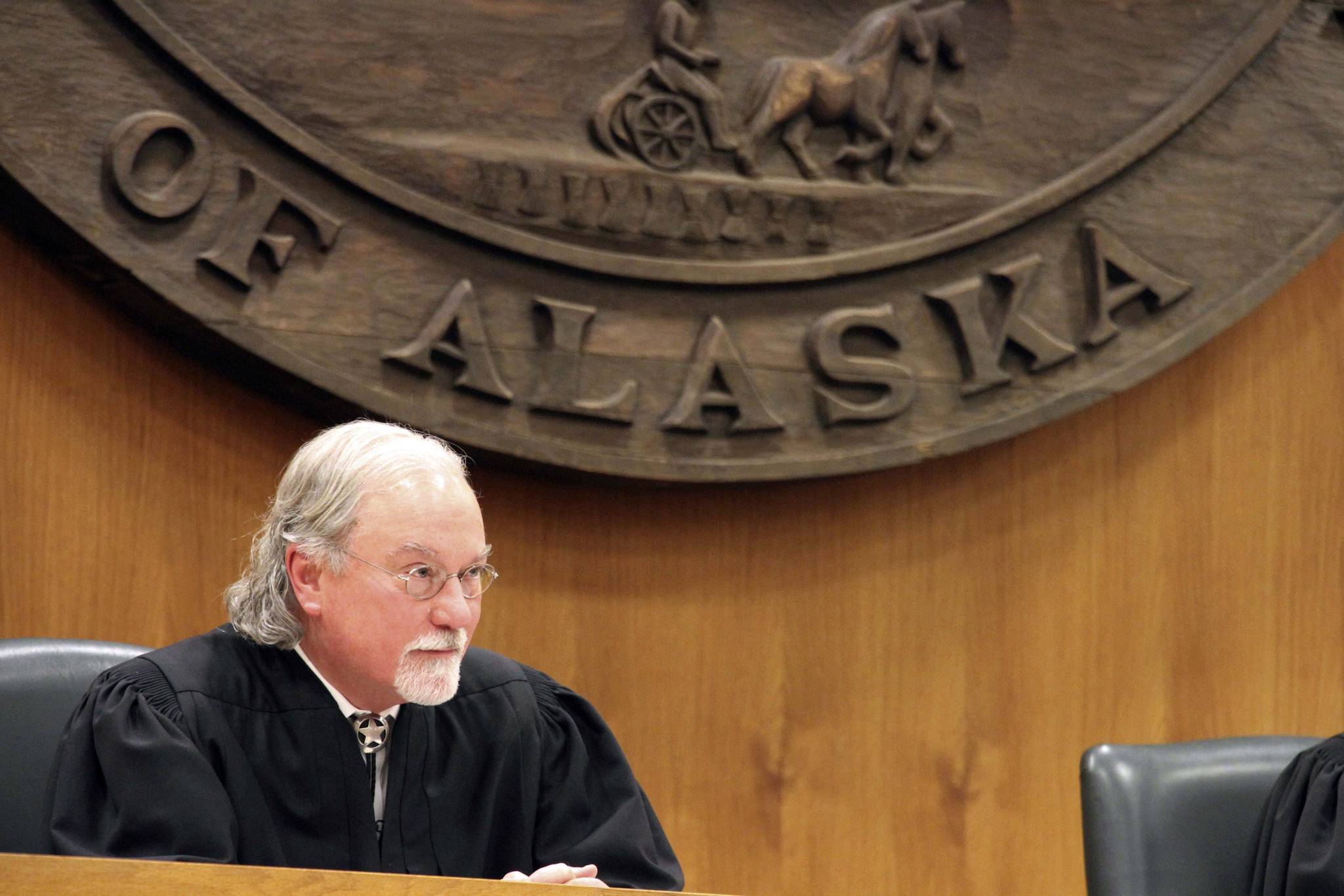 Alaska Supreme Court Justice Craig Stowers listens to arguments in a lawsuit that claims state policy on fossil fuels is harming the constitutional right of young Alaskans to a safe climate Wednesday, Oct. 9, 2019, in Anchorage, Alaska. Sixteen Alaska youths in 2017 sued the state, claiming that human-caused greenhouse gas emission leading to climate change is creating long-term, dangerous health effects. They lost in Superior Court, but appealed to Alaskas highest court. (AP Photo/Mark Thiessen)