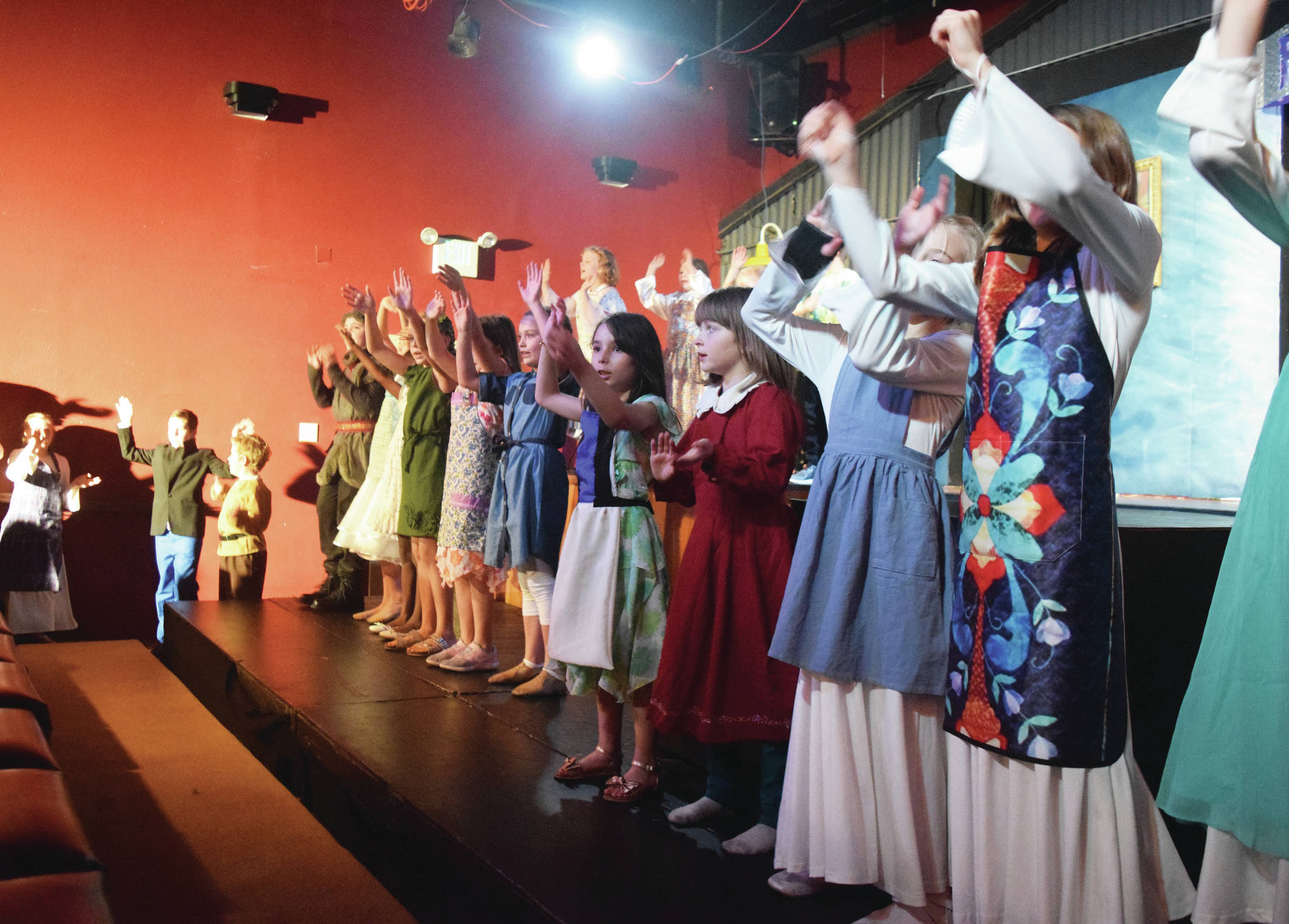 The youth cast of “Frozen Jr.” rehearse a scene Wednesday, Oct. 9, 2019, at the Triumvirate North theater in Kenai, Alaska. (Photo by Joey Klecka/Peninsula Clarion)