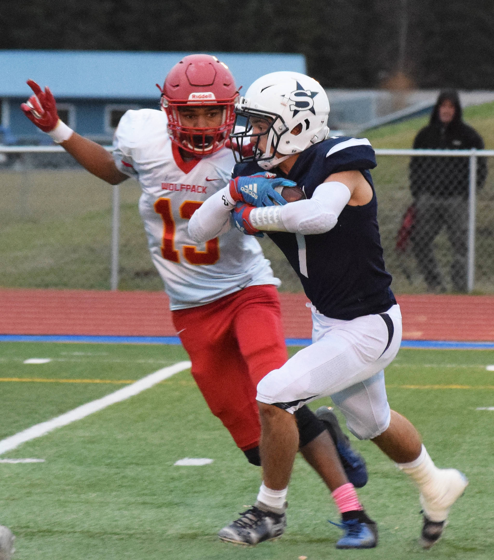 Soldotna’s Wyatt Medcoff slips through the West Valley defense in a Div. II state semifinal Friday, Oct. 11, 2019, in Soldotna, Alaska. (Photo by Joey Klecka/Peninsula Clarion)